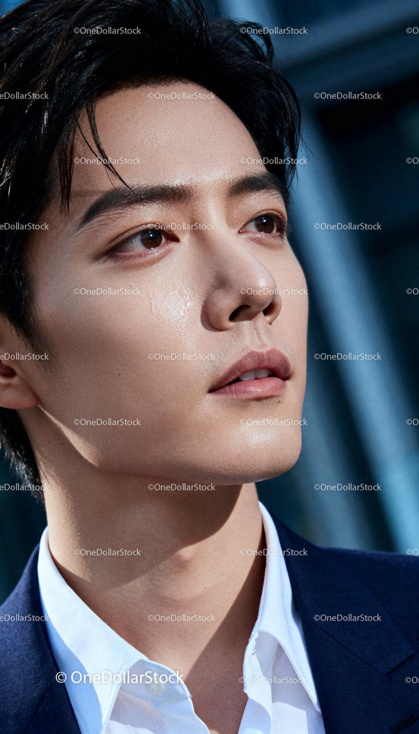 Close Up of Thoughtful Young Man with Natural Skin Glow