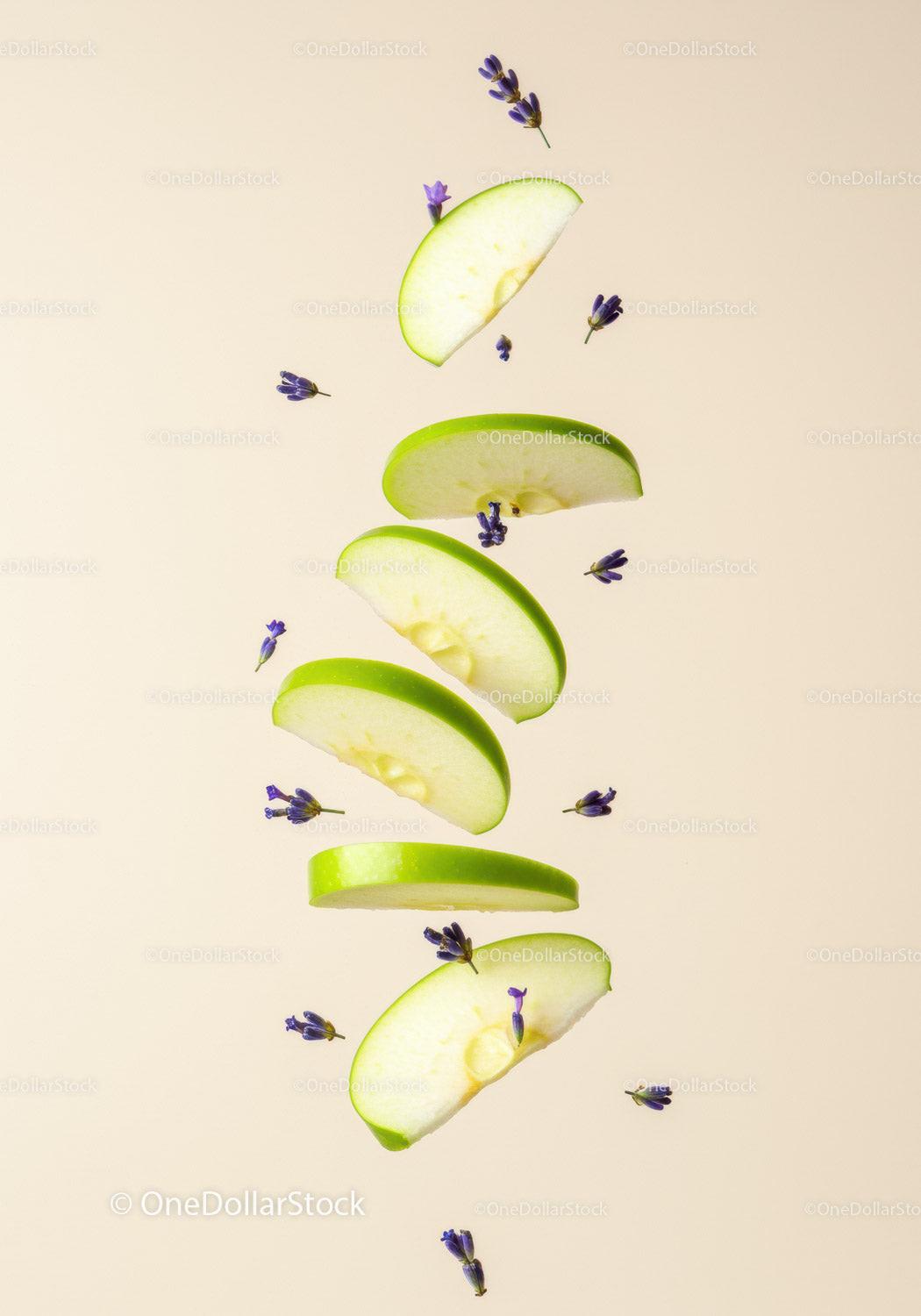 Floating green apple slices with delicate lavender buds