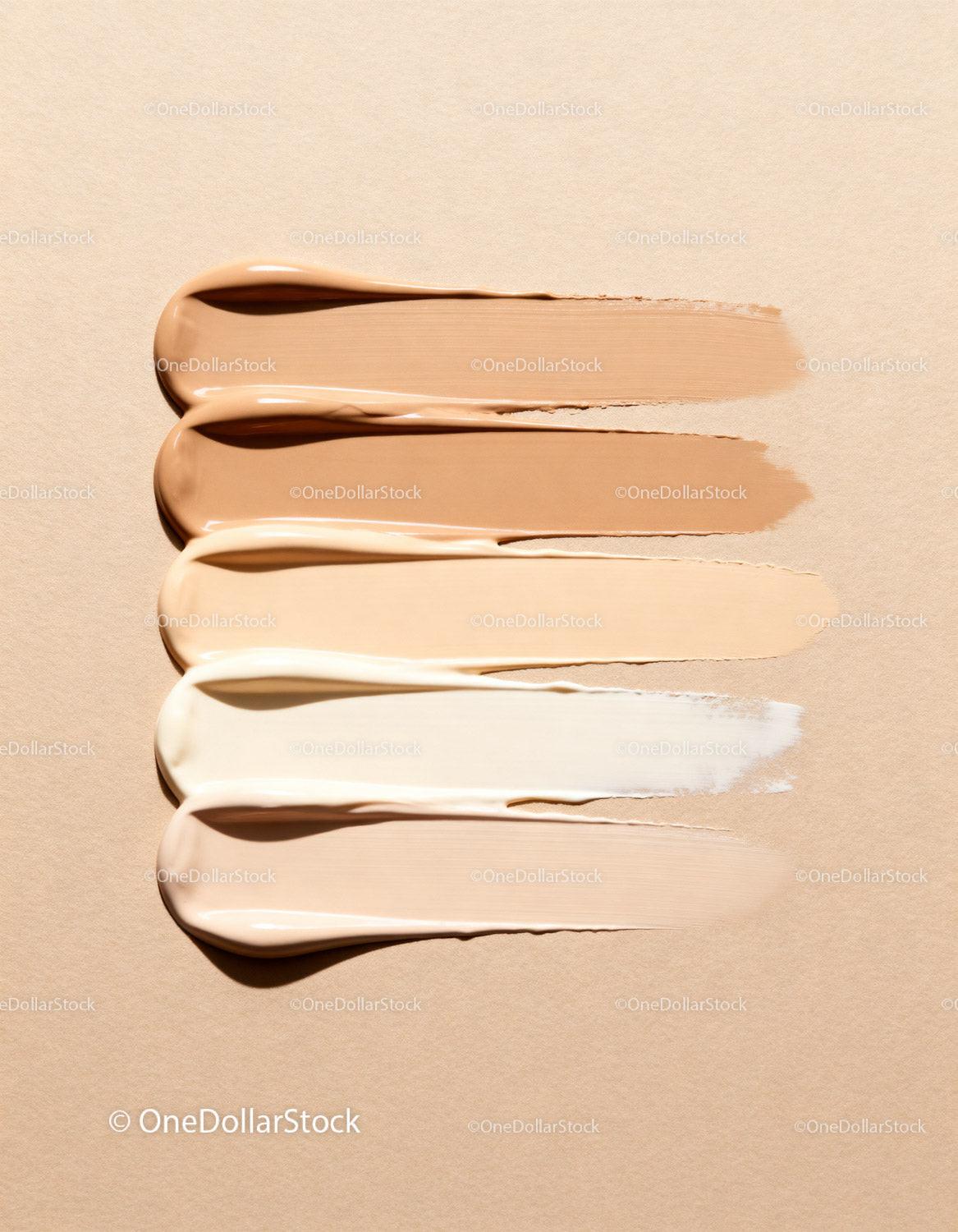 Various shades of creamy liquid foundation swatches
