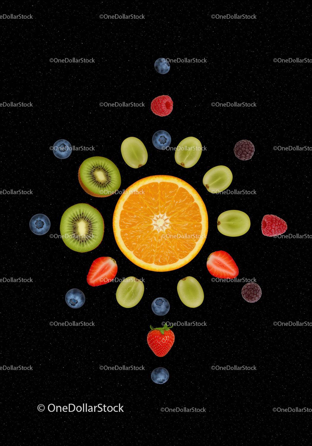 Fresh mixed fruits arranged on black background