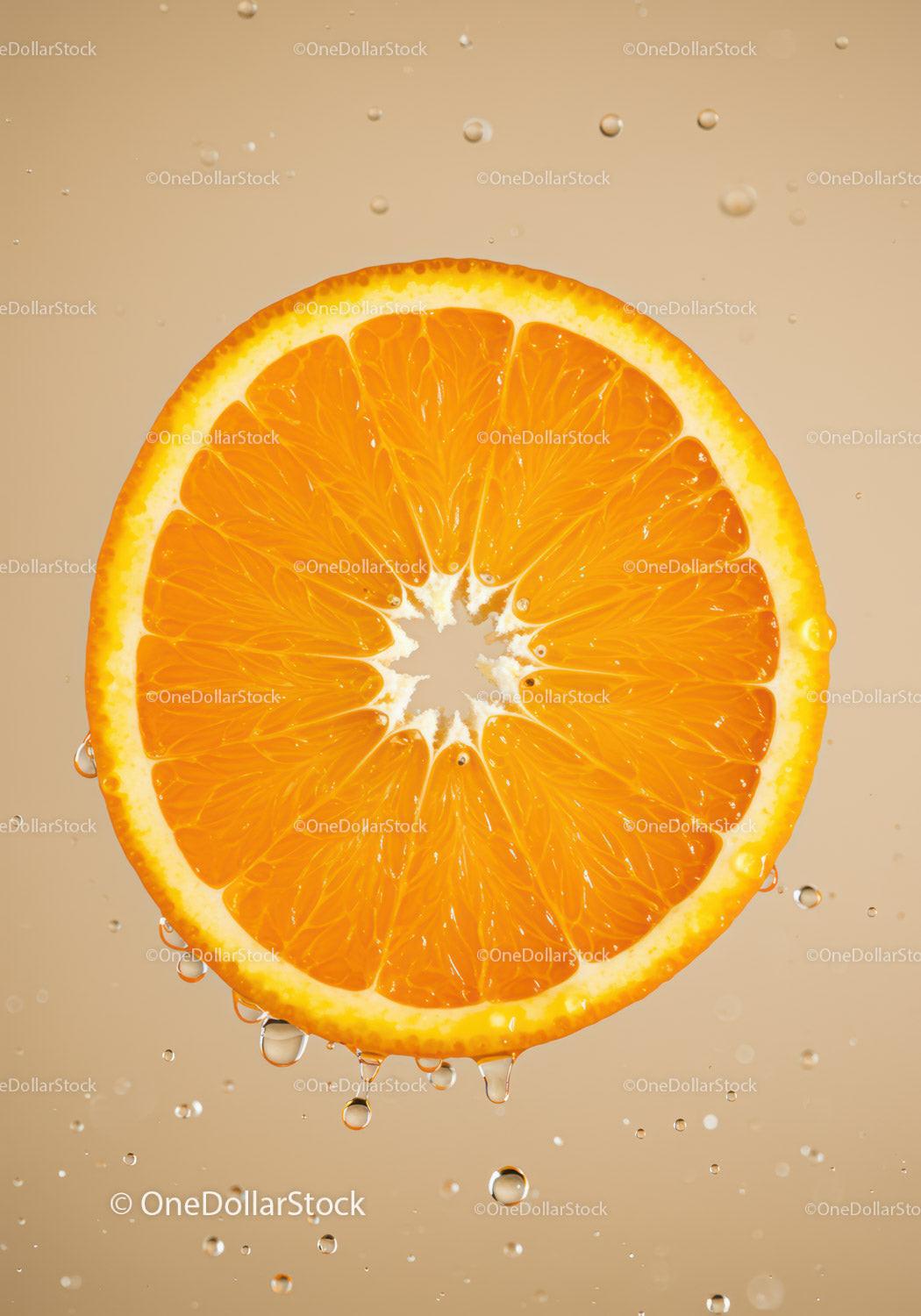 Fresh orange slice with water droplets in soft light