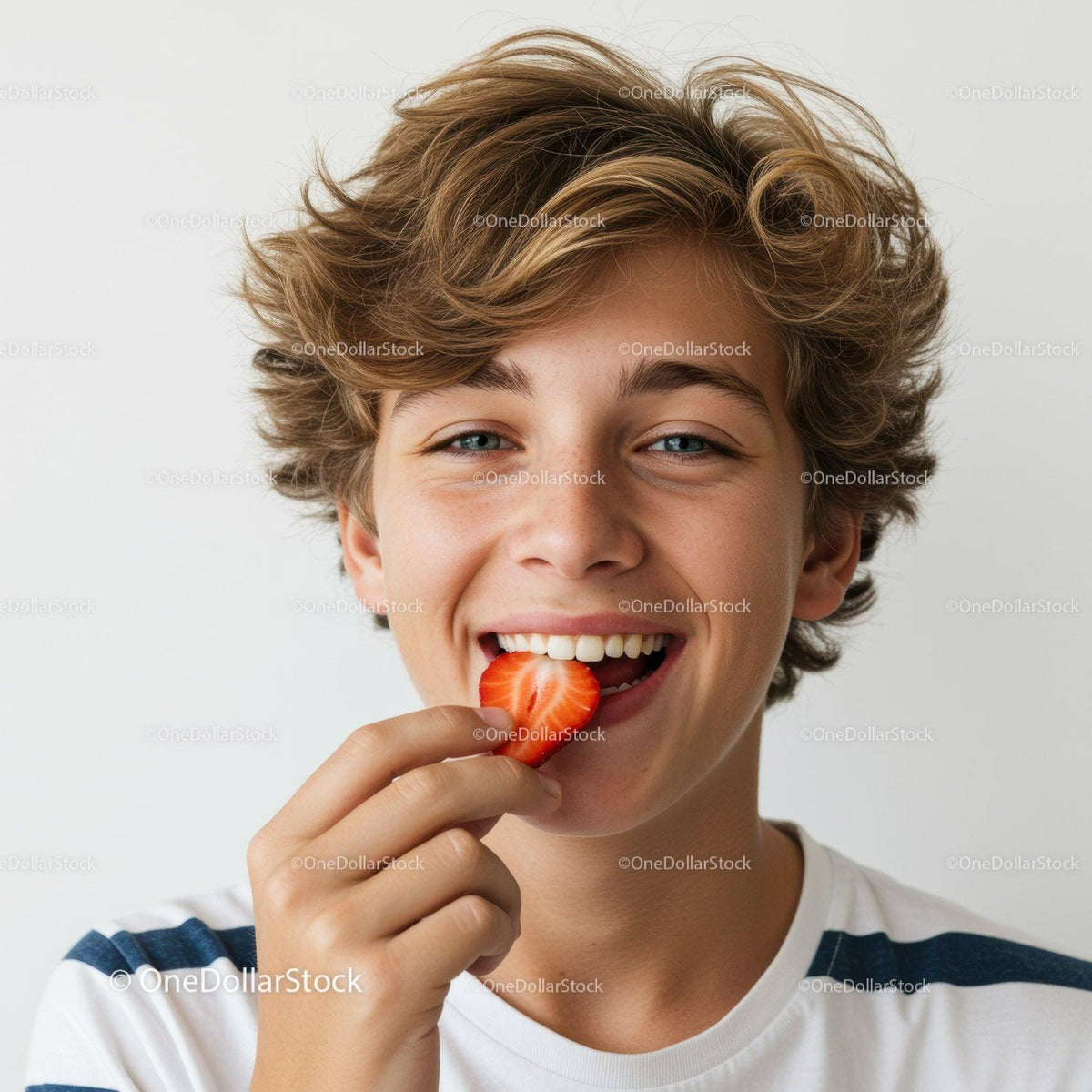 Smiling Young Boy Enjoying Strawberry Against Bright Background