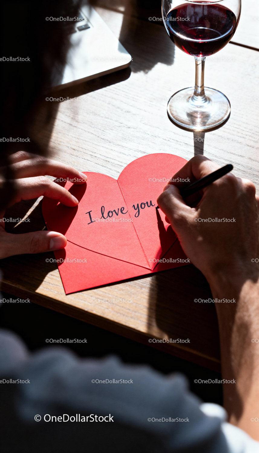 Writing a Love Note on a Heart Shaped Card