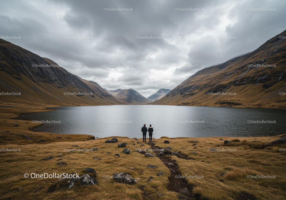 Scenic Mountain Lake with Rugged Valleys and Overcast Sky