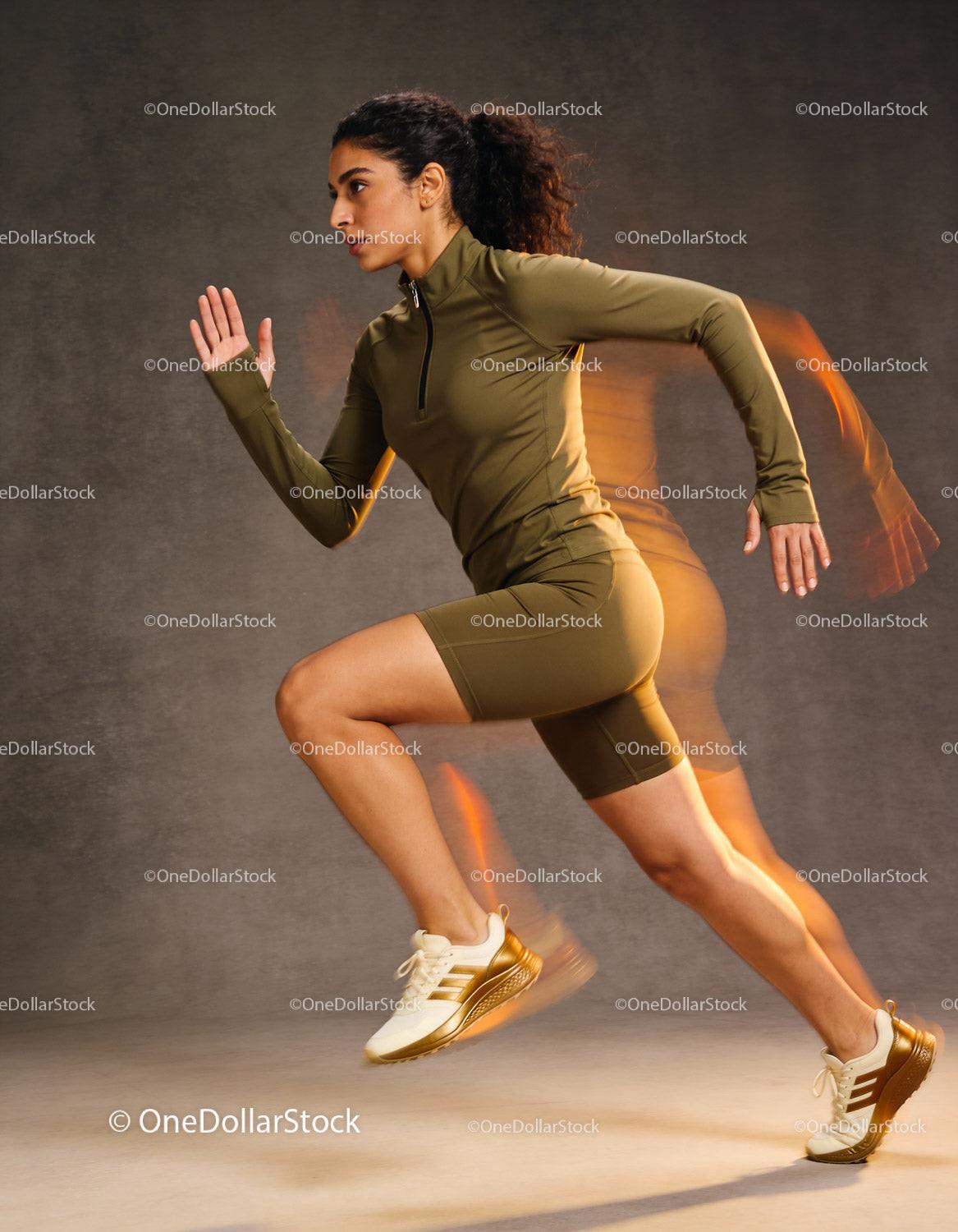 Athletic woman sprinting with dynamic motion blur