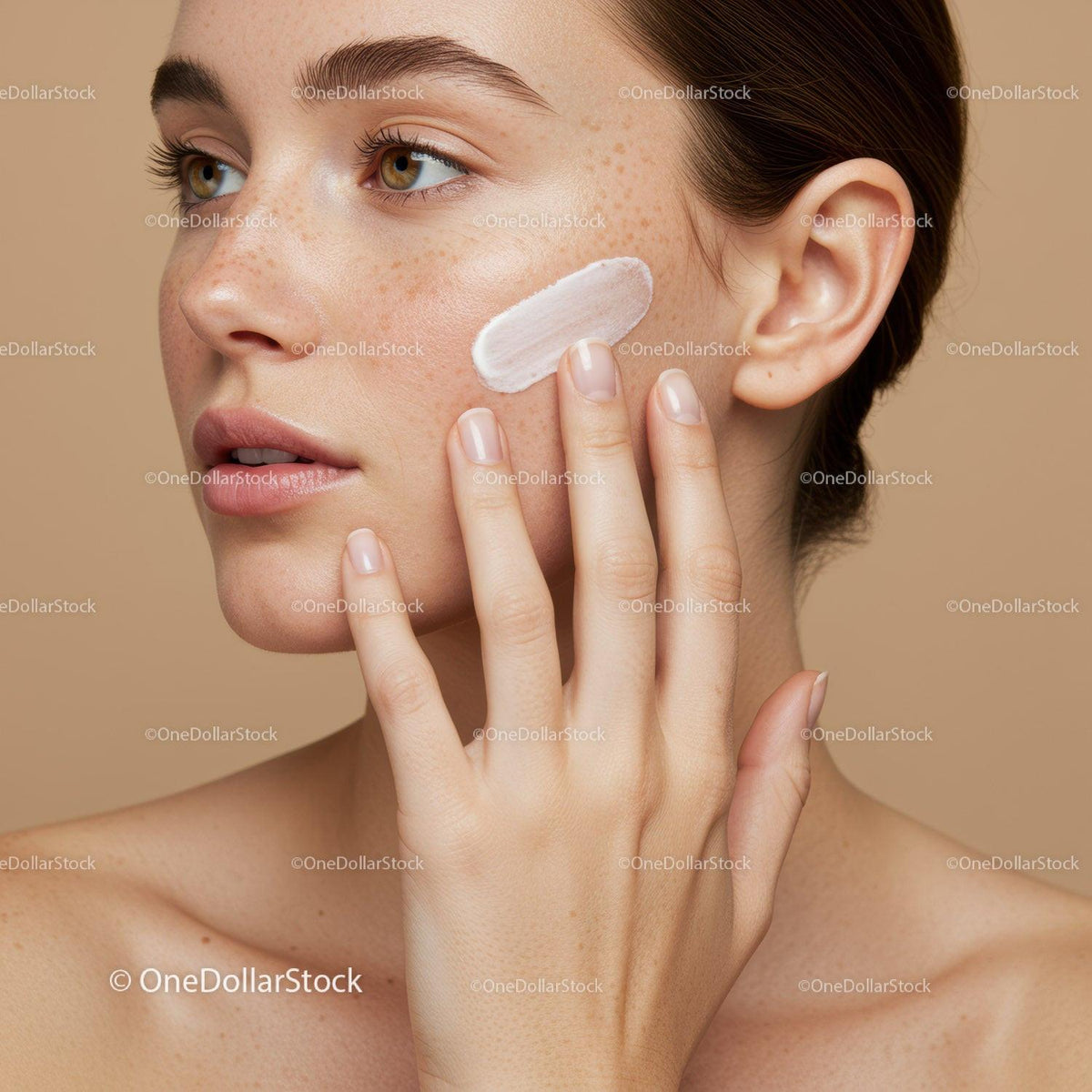 Close-up of Woman Applying Face Cream for Skincare Routine with Flawless Skin
