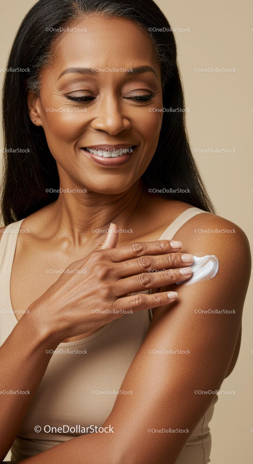 Elegant Woman Applying Lotion to Shoulder for Beautiful Skin