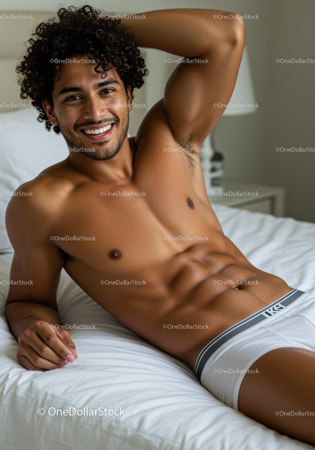 Smiling shirtless man relaxing on bed in bright room