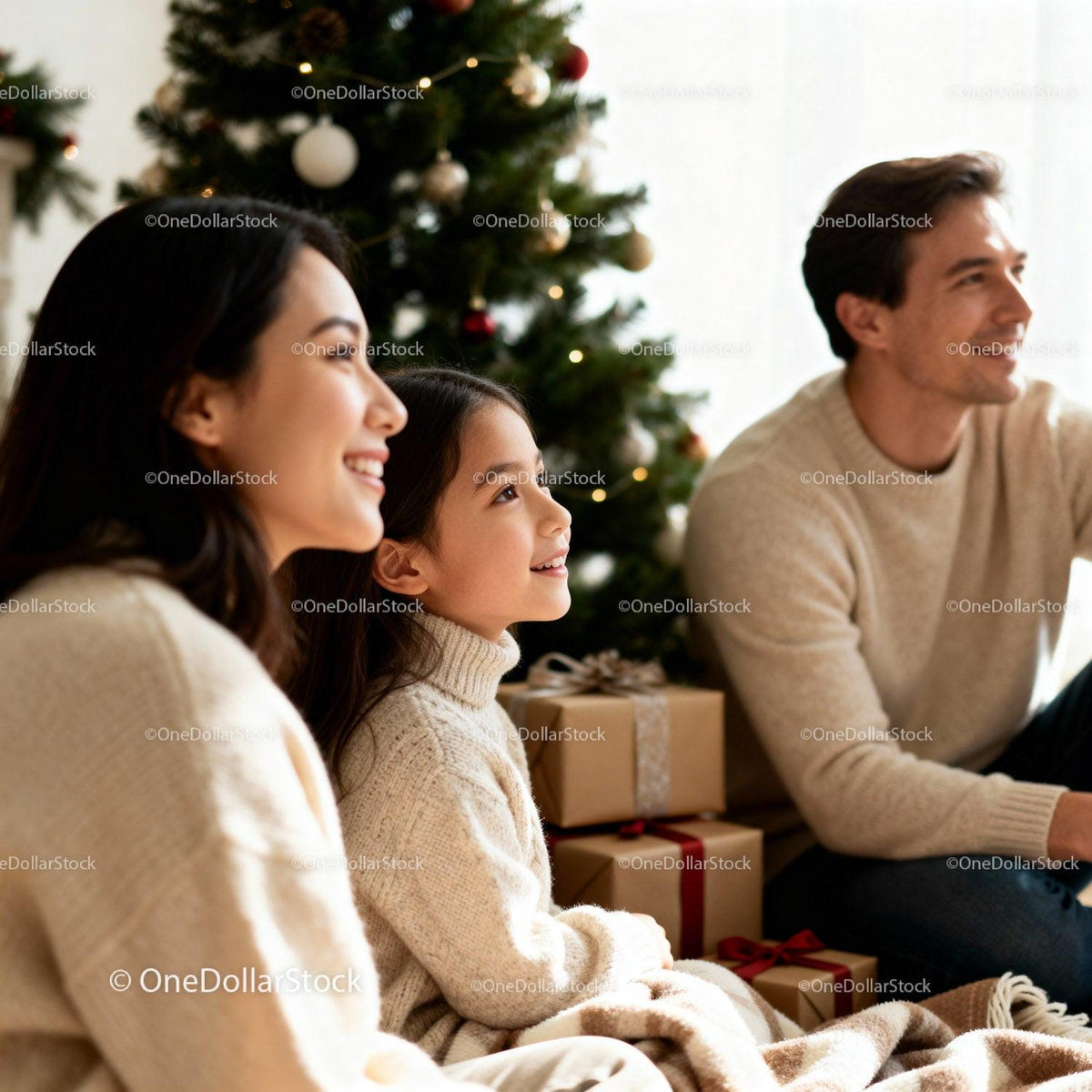 Family enjoying festive moment by Christmas tree