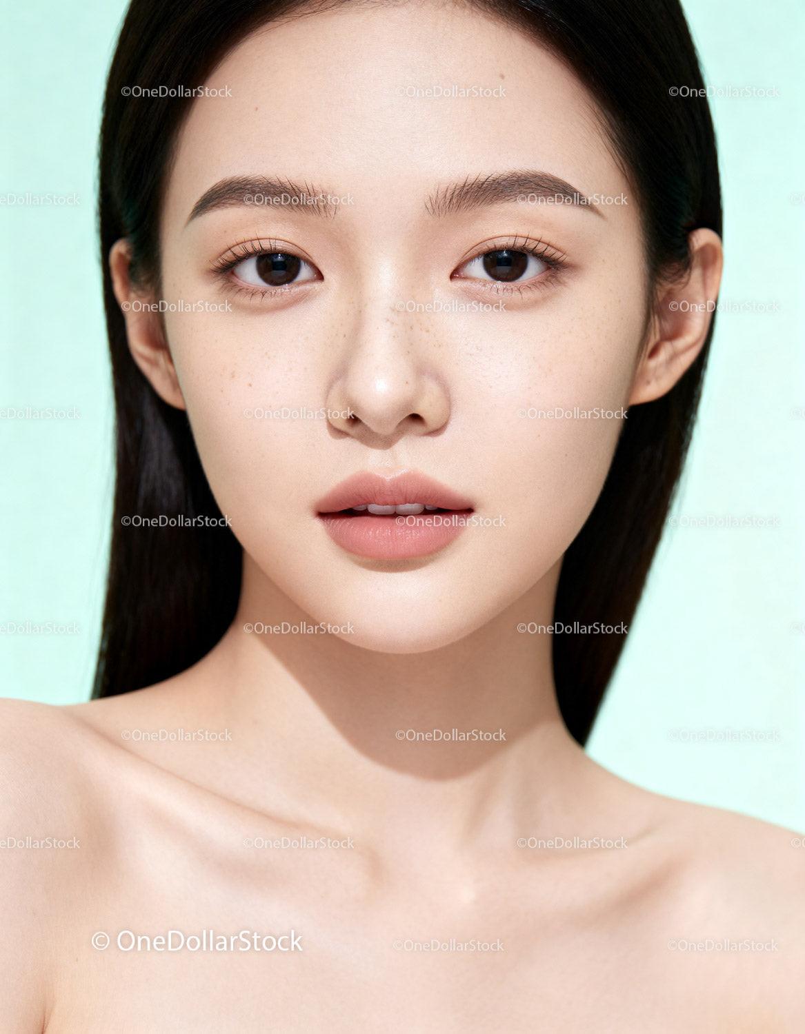 Close up of serene young woman with flawless skin