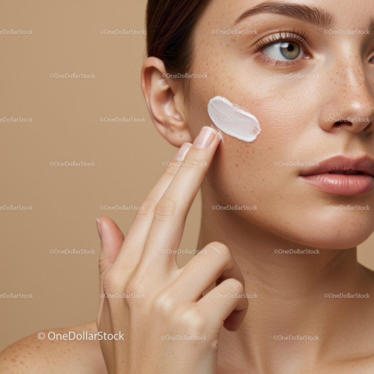 Close-Up of Woman Applying Sunscreen on Face for Skin Protection