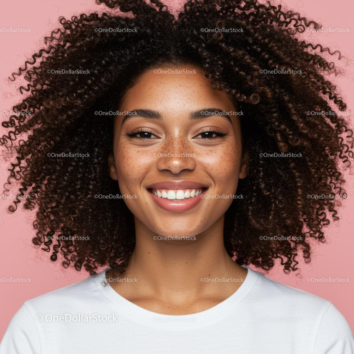 Bright Smile of Woman with Curly Hair Against Pink Background