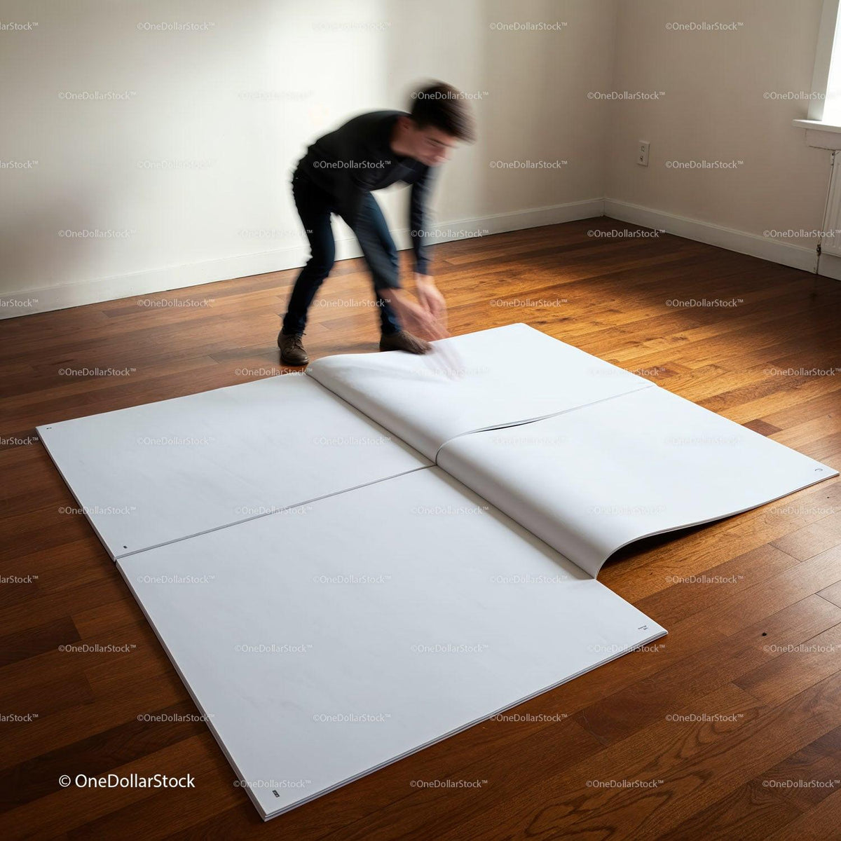 Person flipping through large blank pages on wooden floor JPG Mockup Image preview