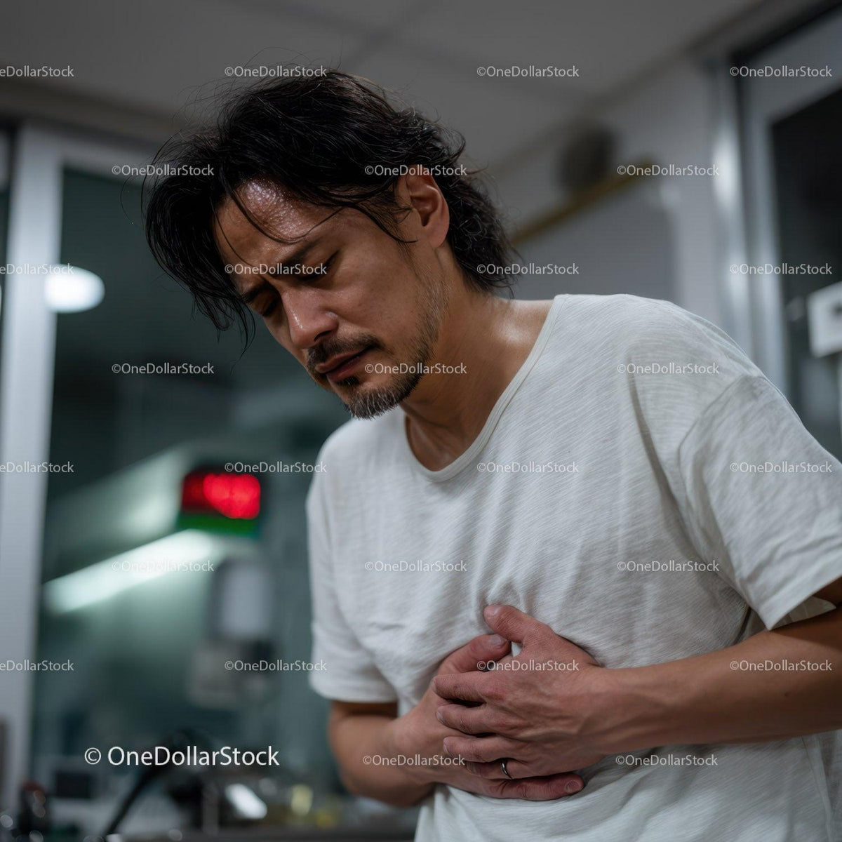 Man Experiencing Chest Pain in Indoor Environment