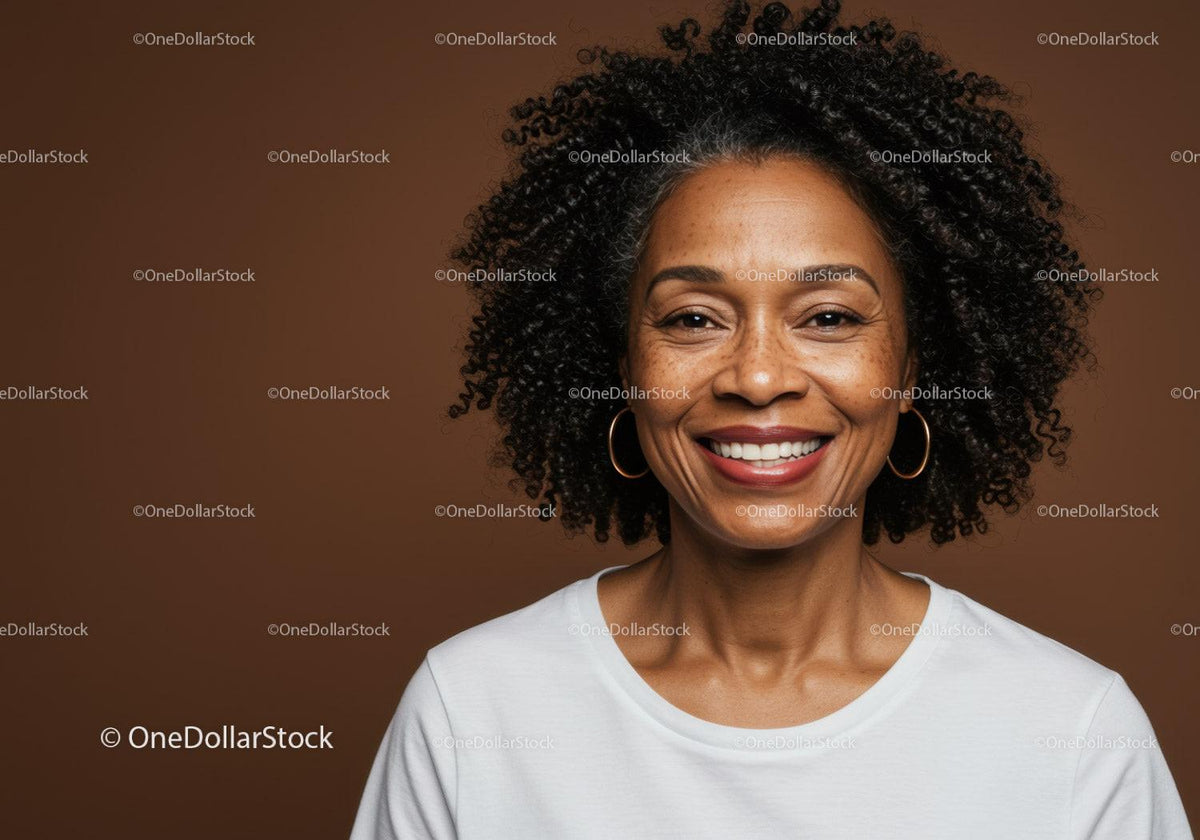 Close-Up Portrait of Smiling Woman with Curly Hair and Gold Hoop Earrings