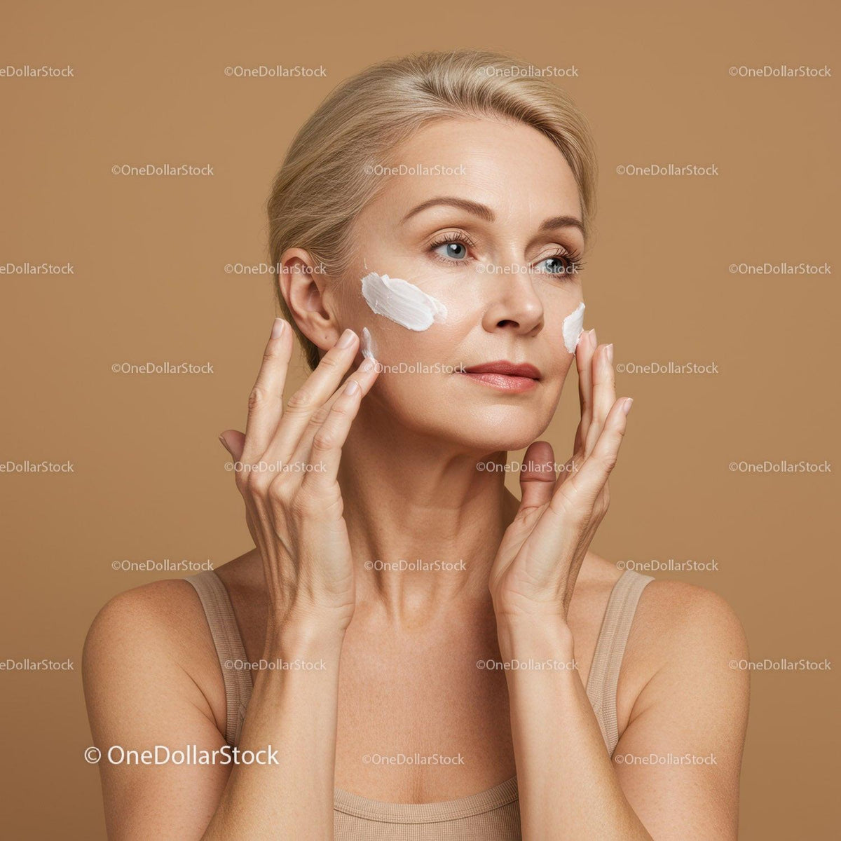 Elegant Woman Applying Skincare Cream for Youthful Glow