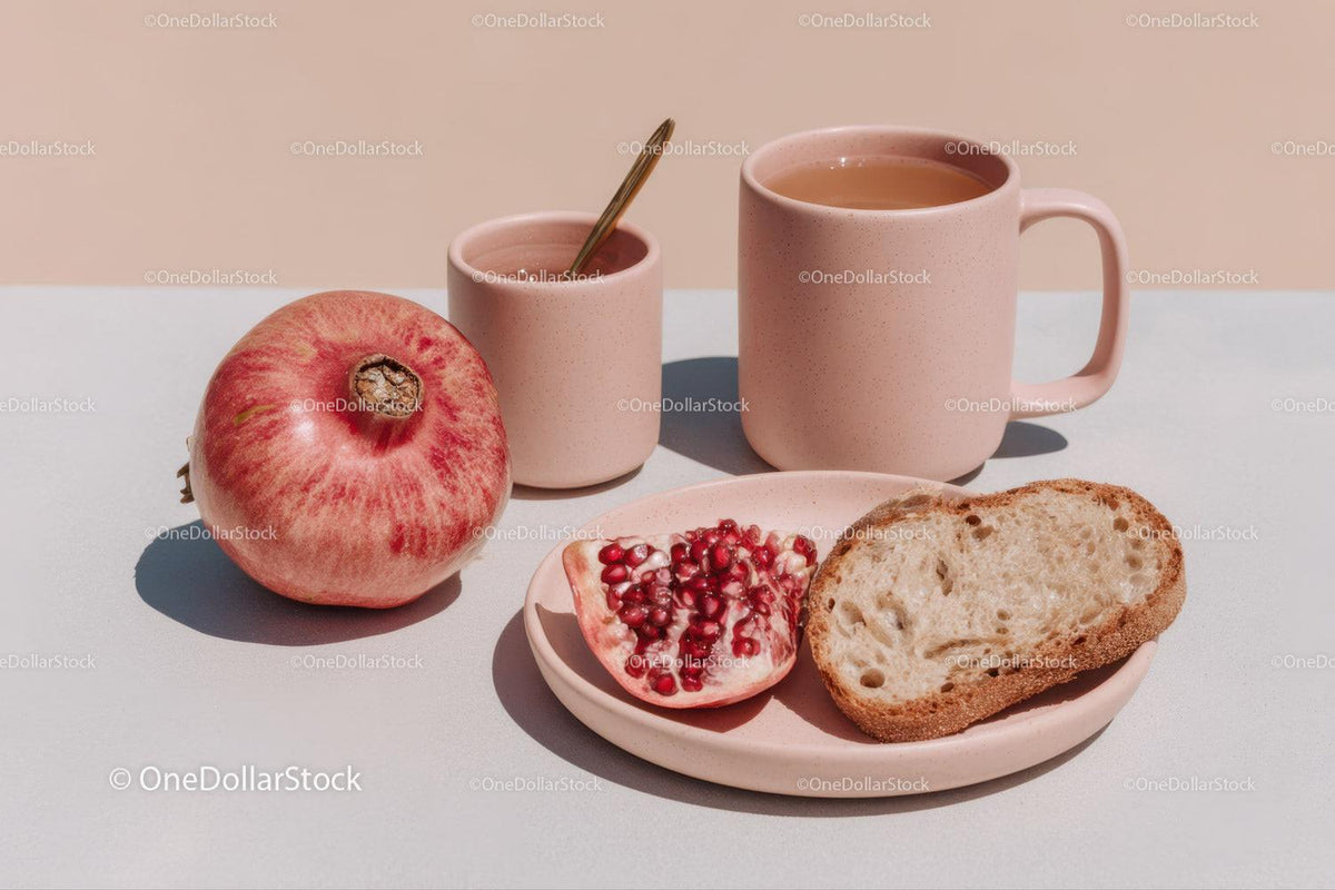Fresh Fruit and Tea Breakfast Scene with Pomegranate and Bread
