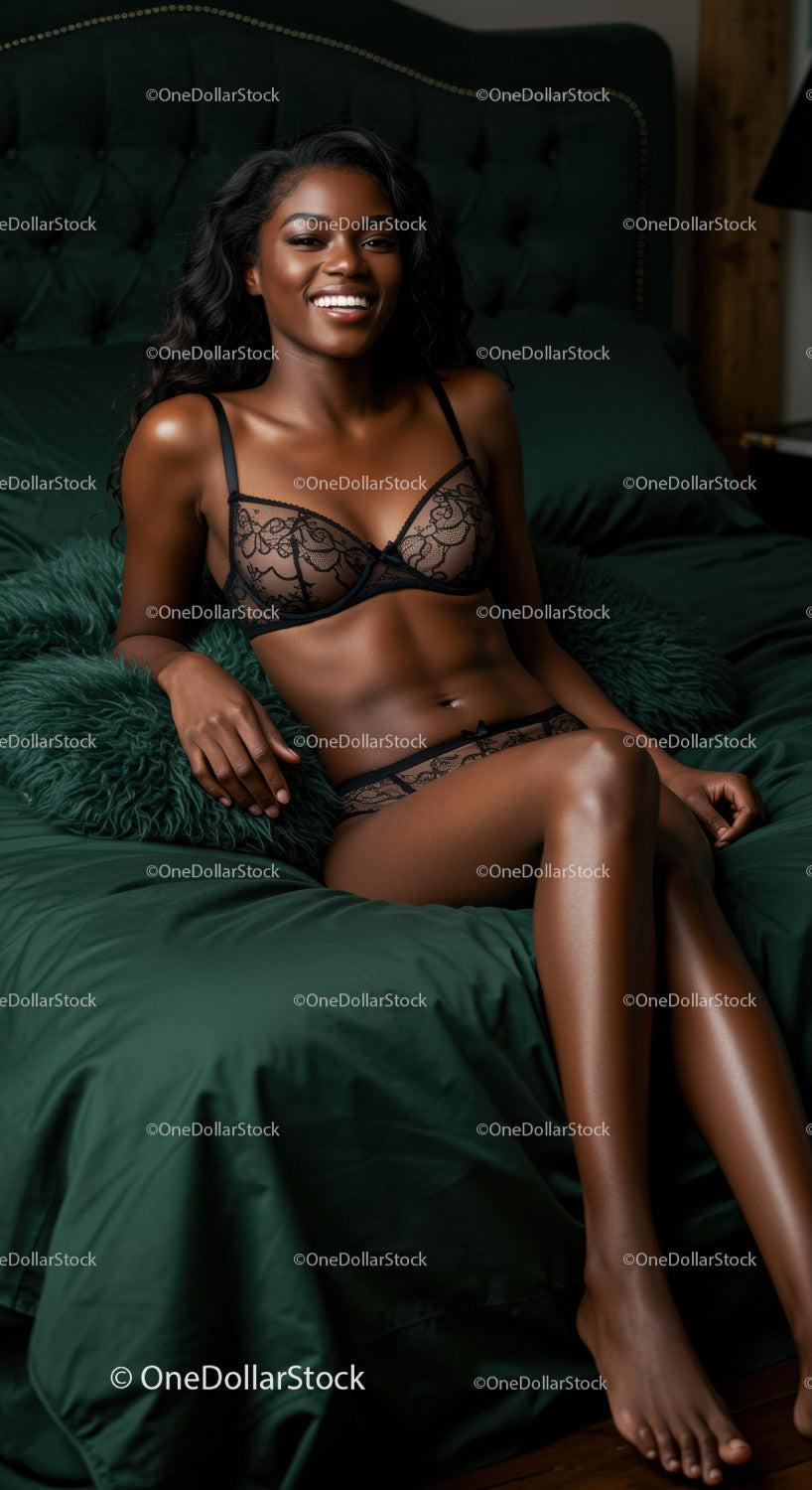 Smiling woman relaxing on dark green bed in black lingerie