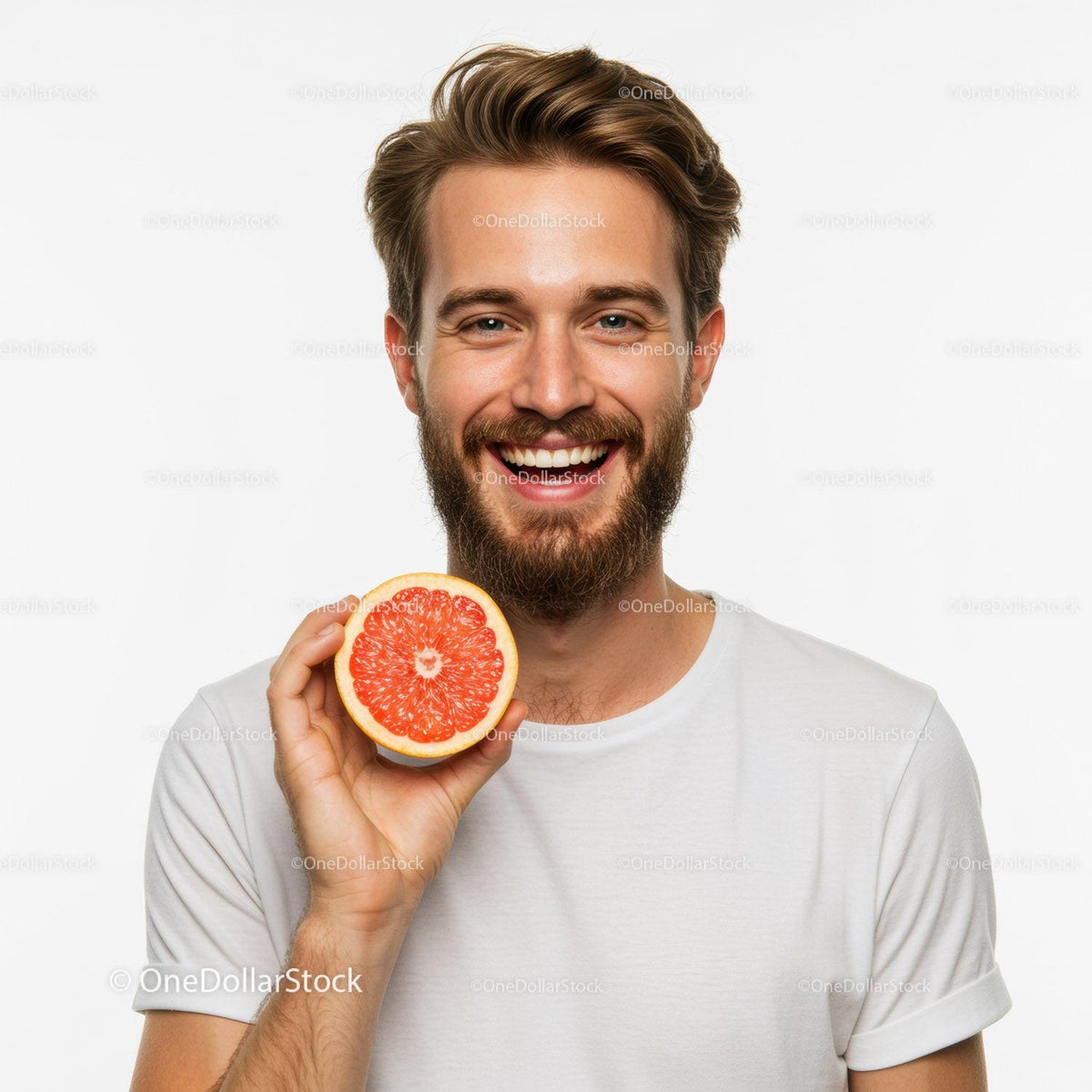 Portrait of Happy Man Holding a Bright Red Grapefruit Slice