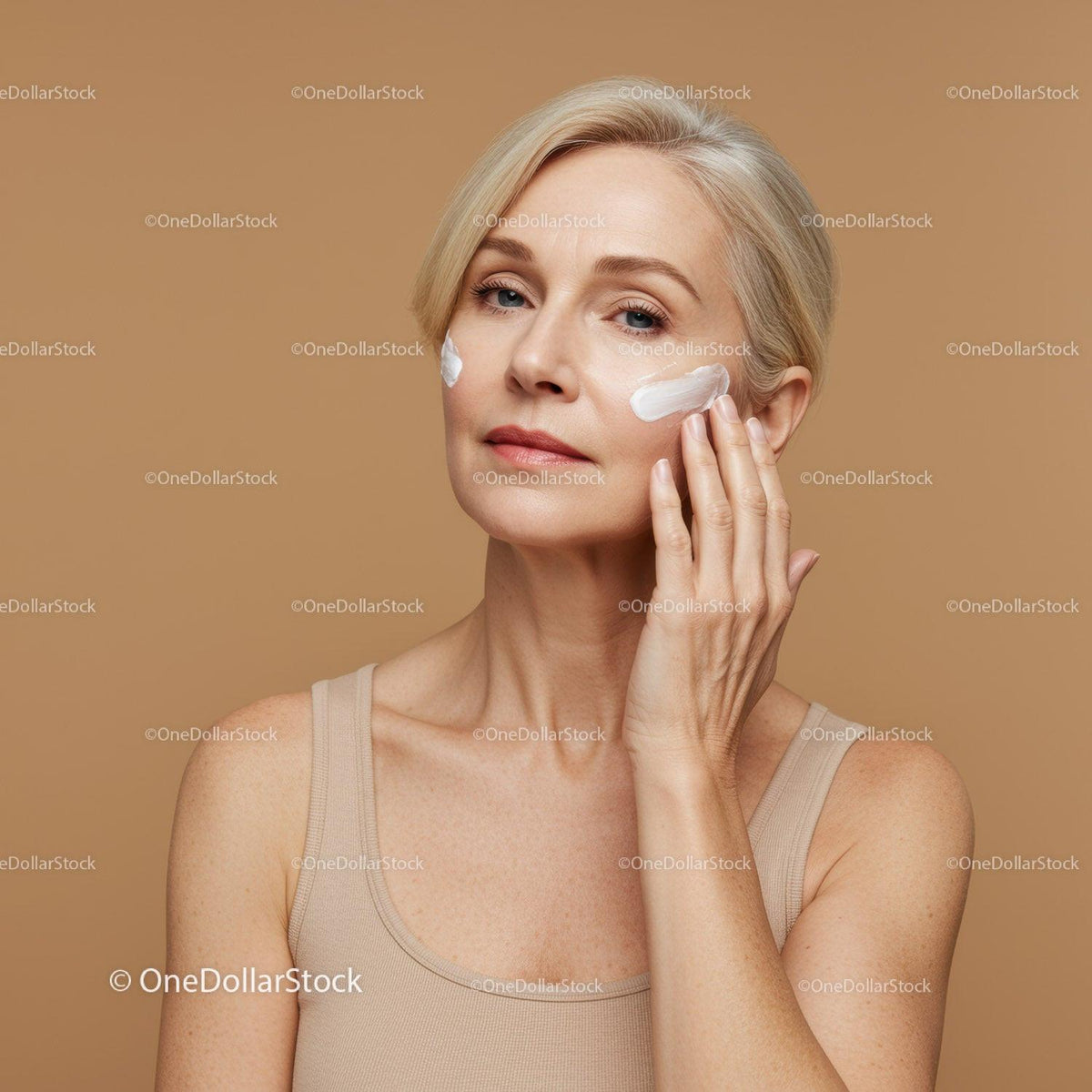 Elegant Woman Applying Skincare Cream for Youthful Skin