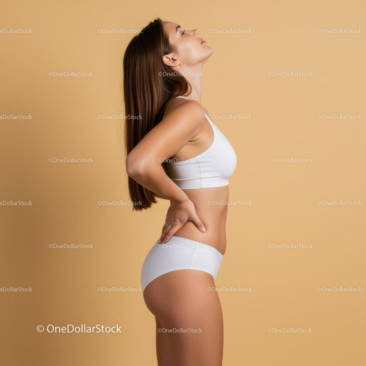 Elegant Woman in White Sportswear Relaxing in Neutral Studio Background