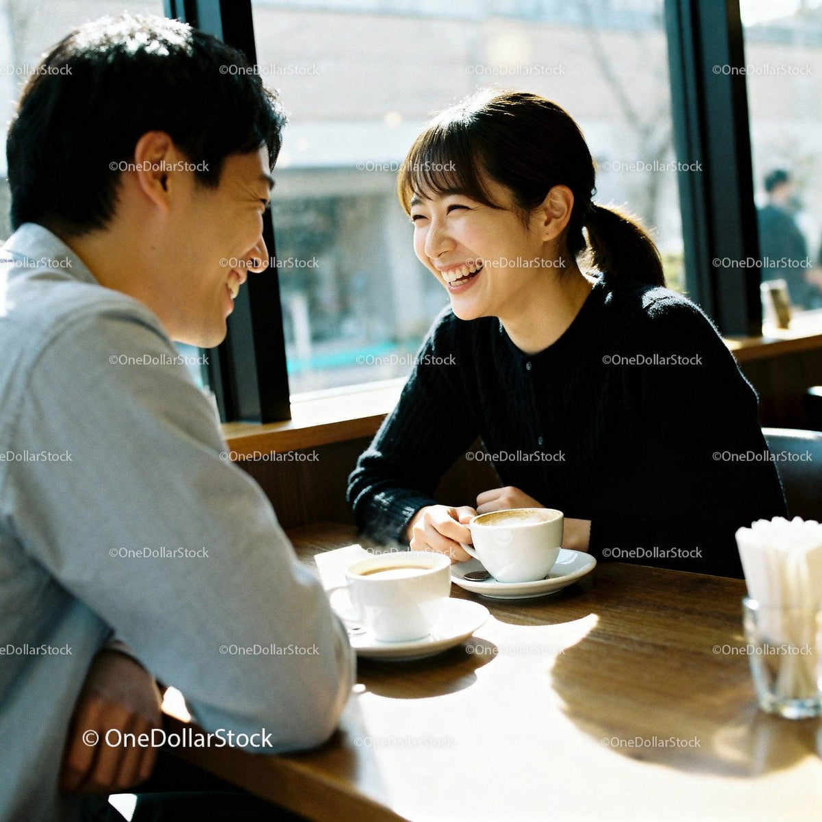 Couple Enjoying Coffee Date with Warm Laughter