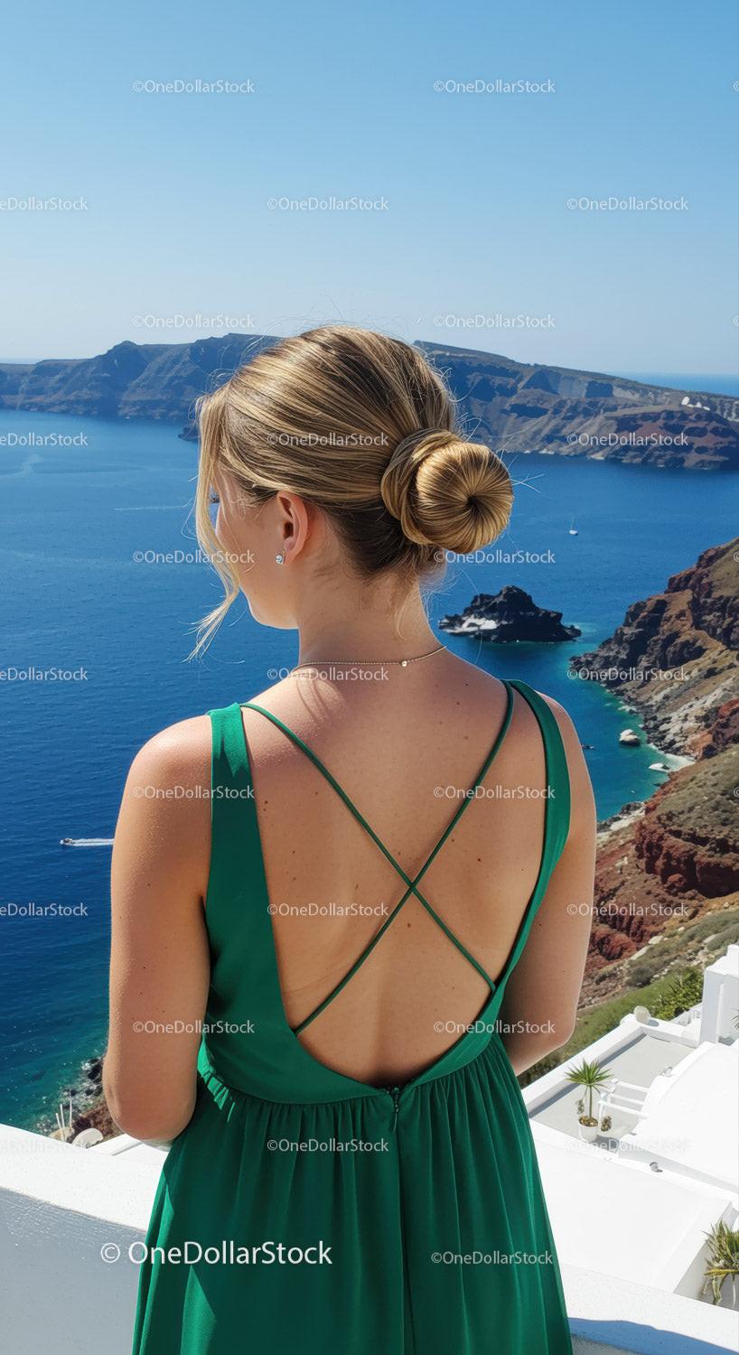 Woman in Green Dress Enjoying Stunning Seaside View