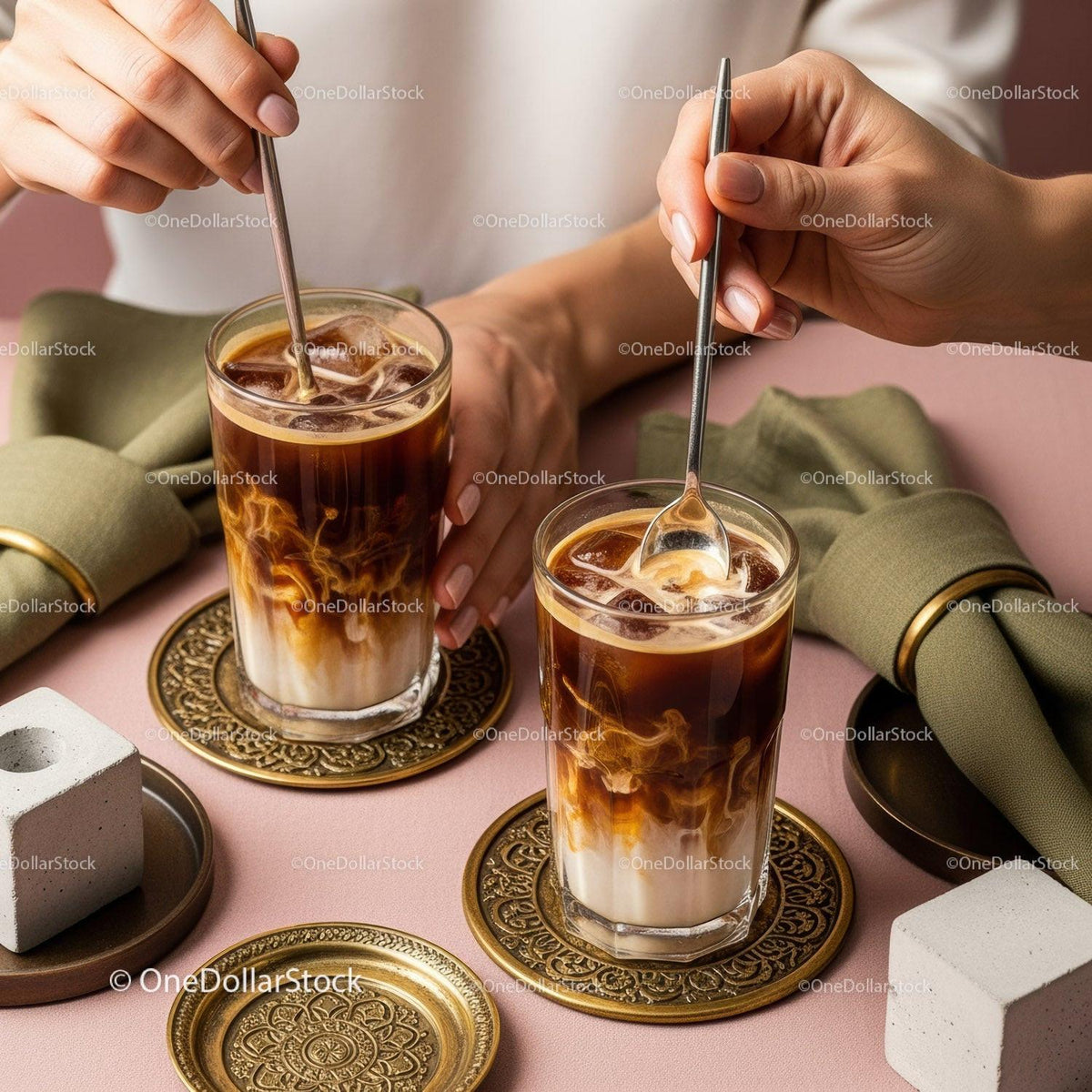 Two Glasses of Iced Coffee with Milk on Stylish Pink Table