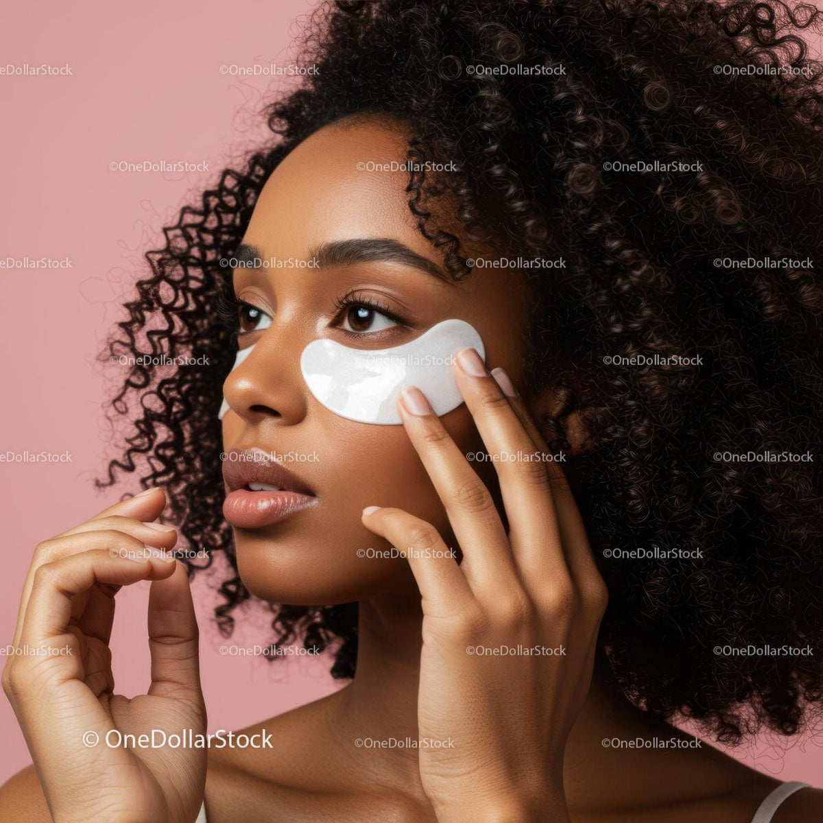 Beautiful Woman Applying Facial Eye Mask for Skin Rejuvenation