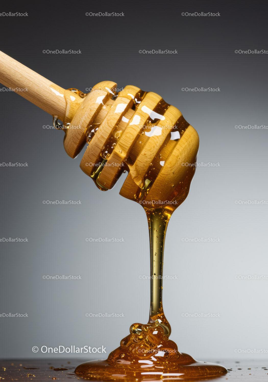Wooden honey dipper dripping golden honey