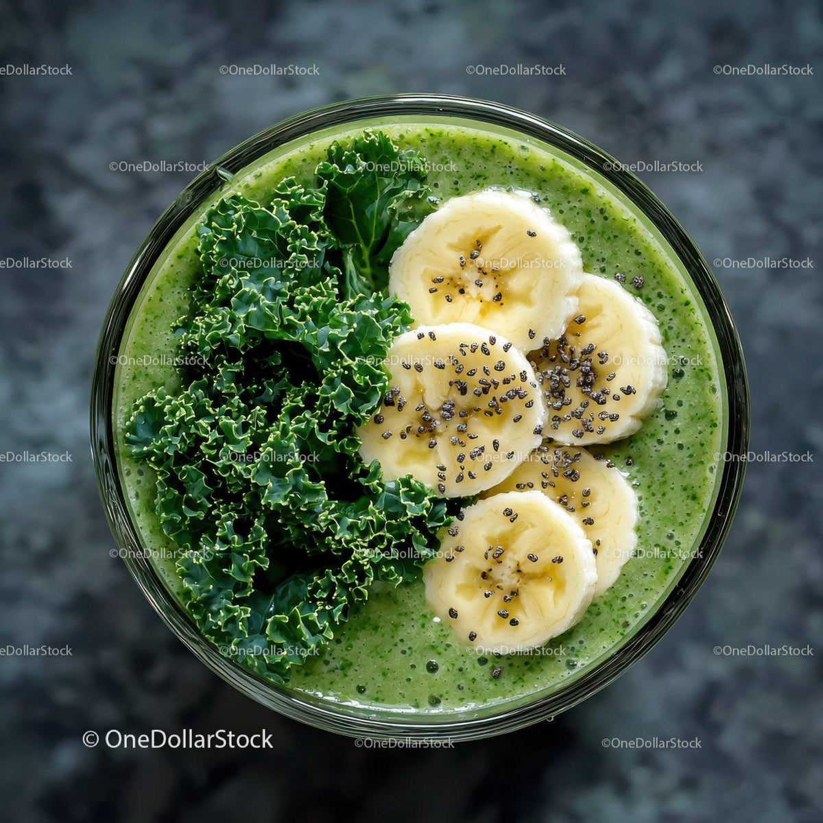 Fresh Green Smoothie with Banana Slices and Kale Leaves