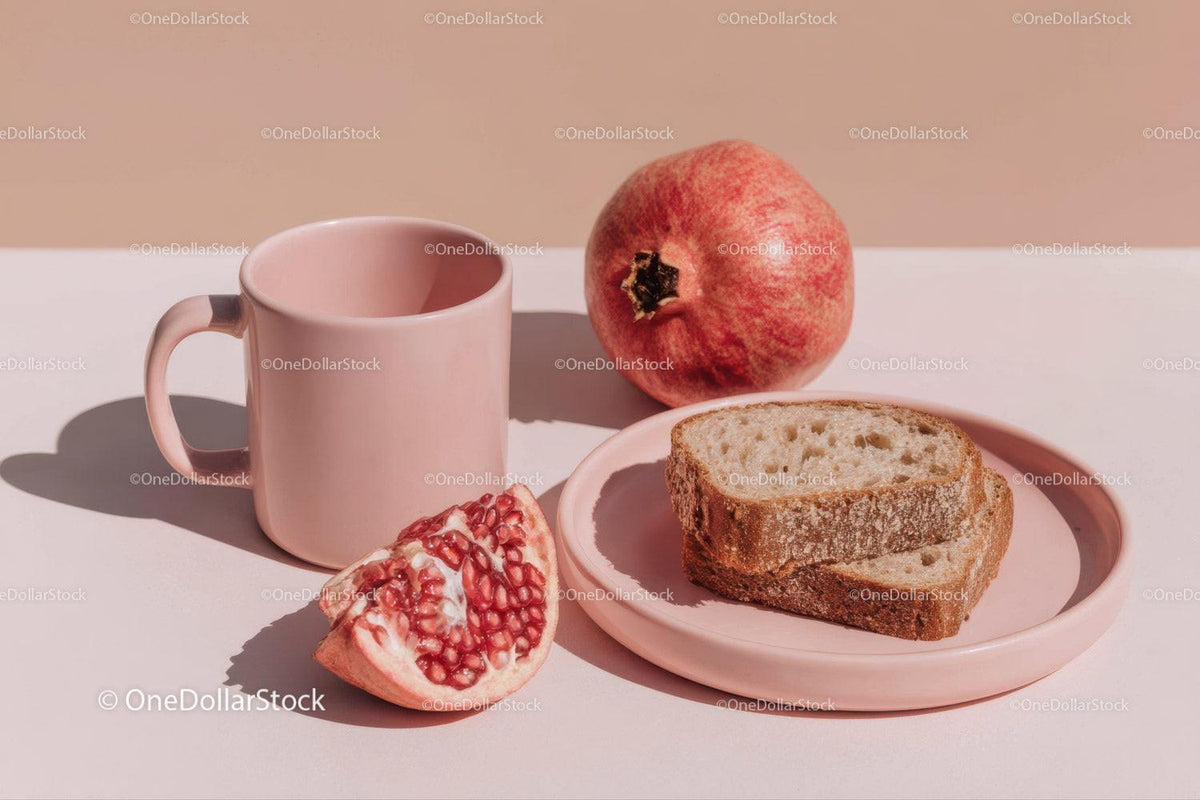 Fresh Pomegranate and Rustic Bread Scene in Soft Natural Light