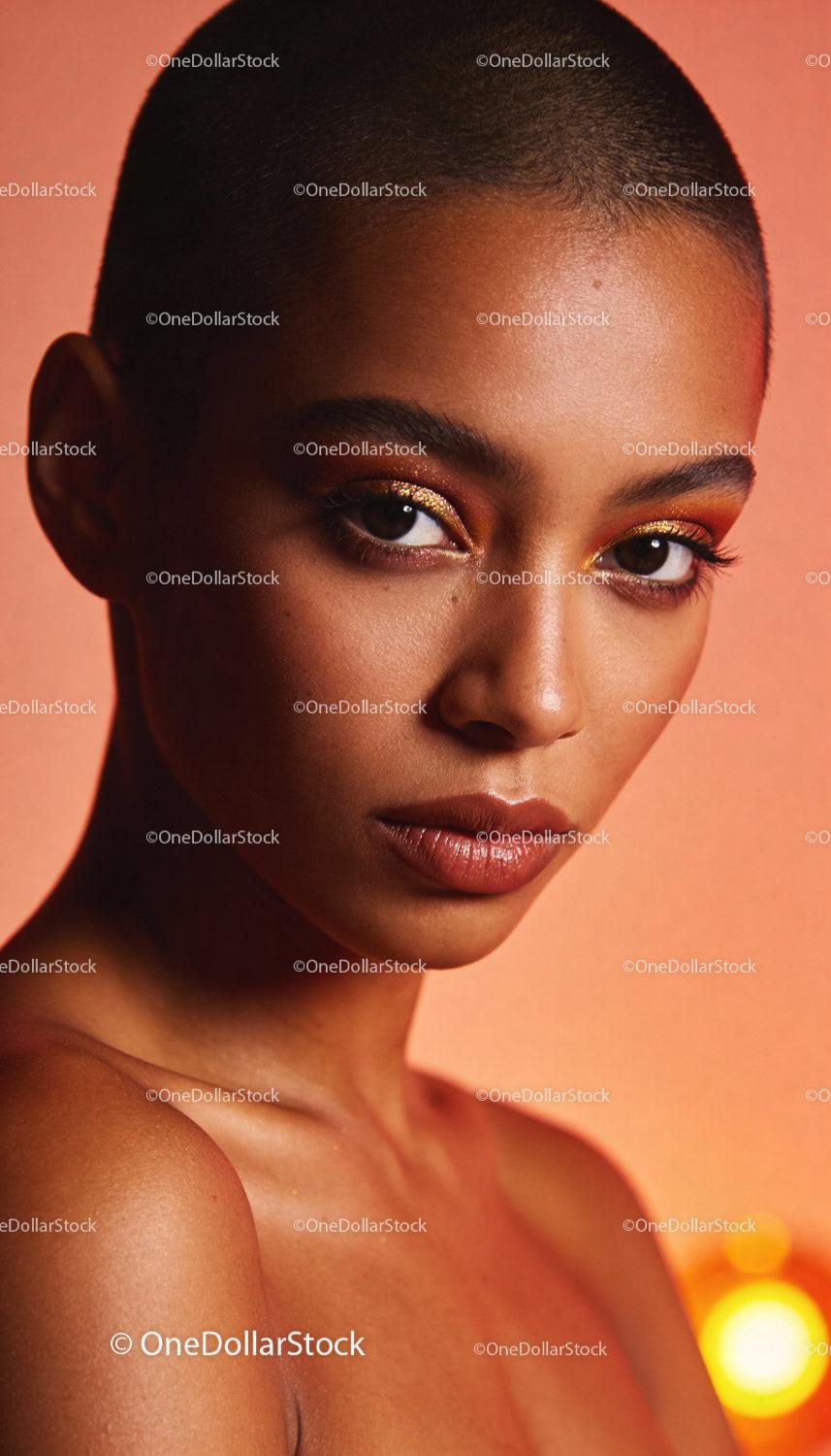 Close-up of confident woman with glowing makeup