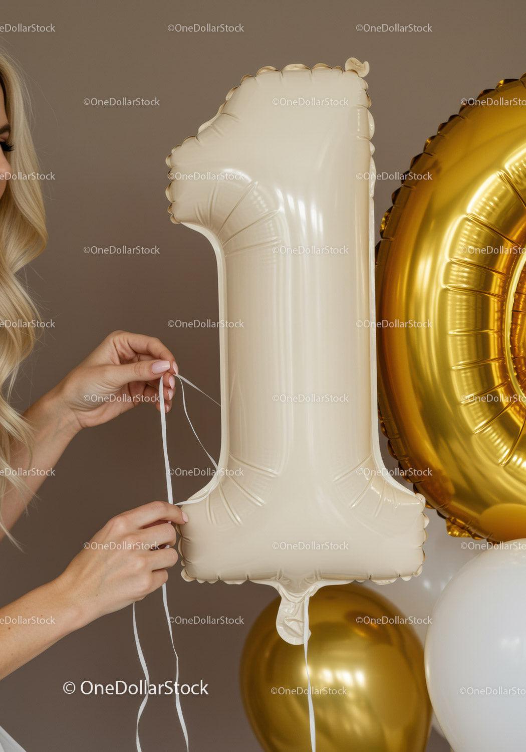 Hands Adjusting White Number One Balloon for Celebration