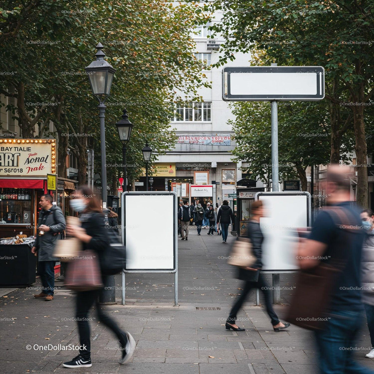 Busy urban walkway with blurred pedestrians and blank signs JPG Mockup Image preview