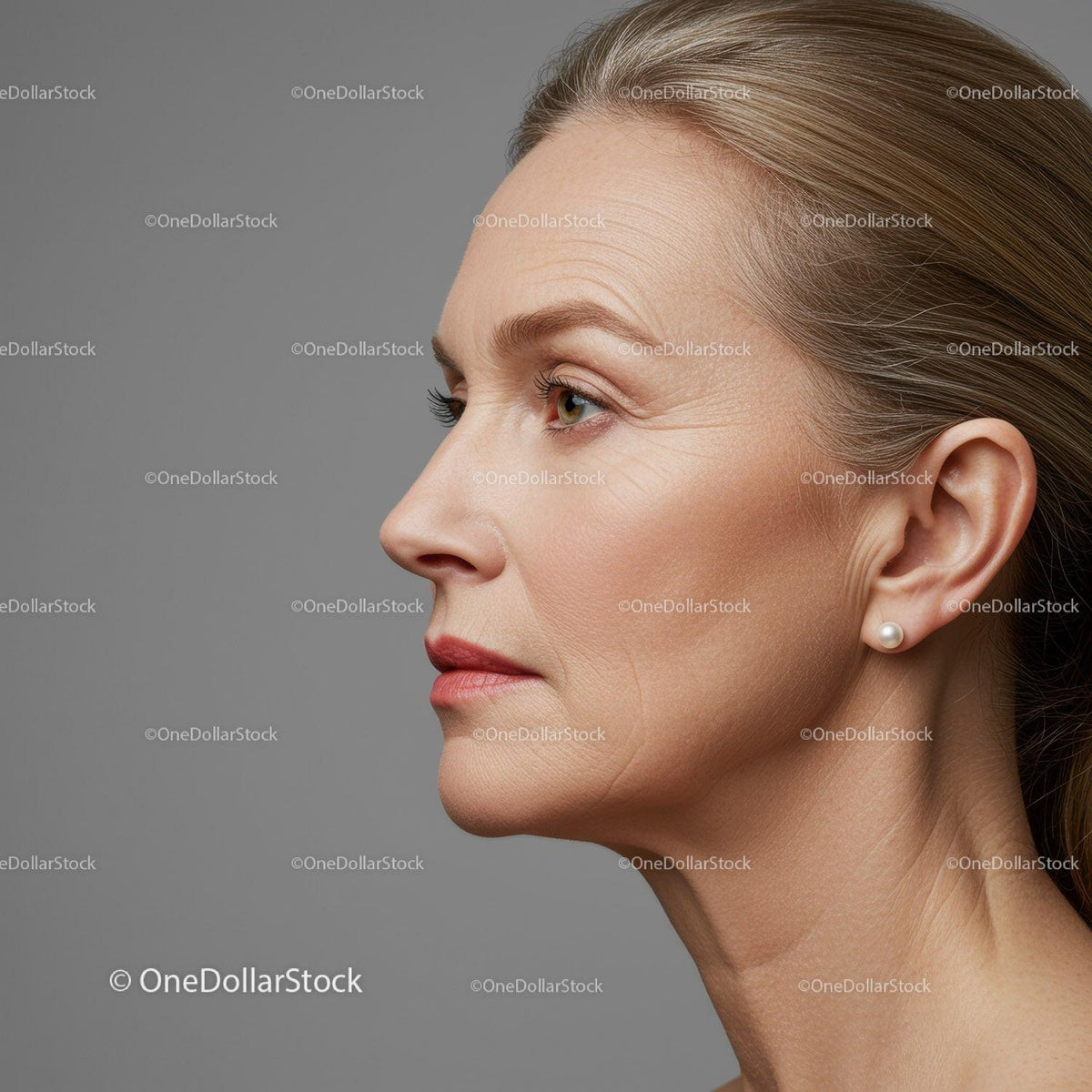 Elegant Mature Woman Profile with Smooth Skin and Pearl Earring