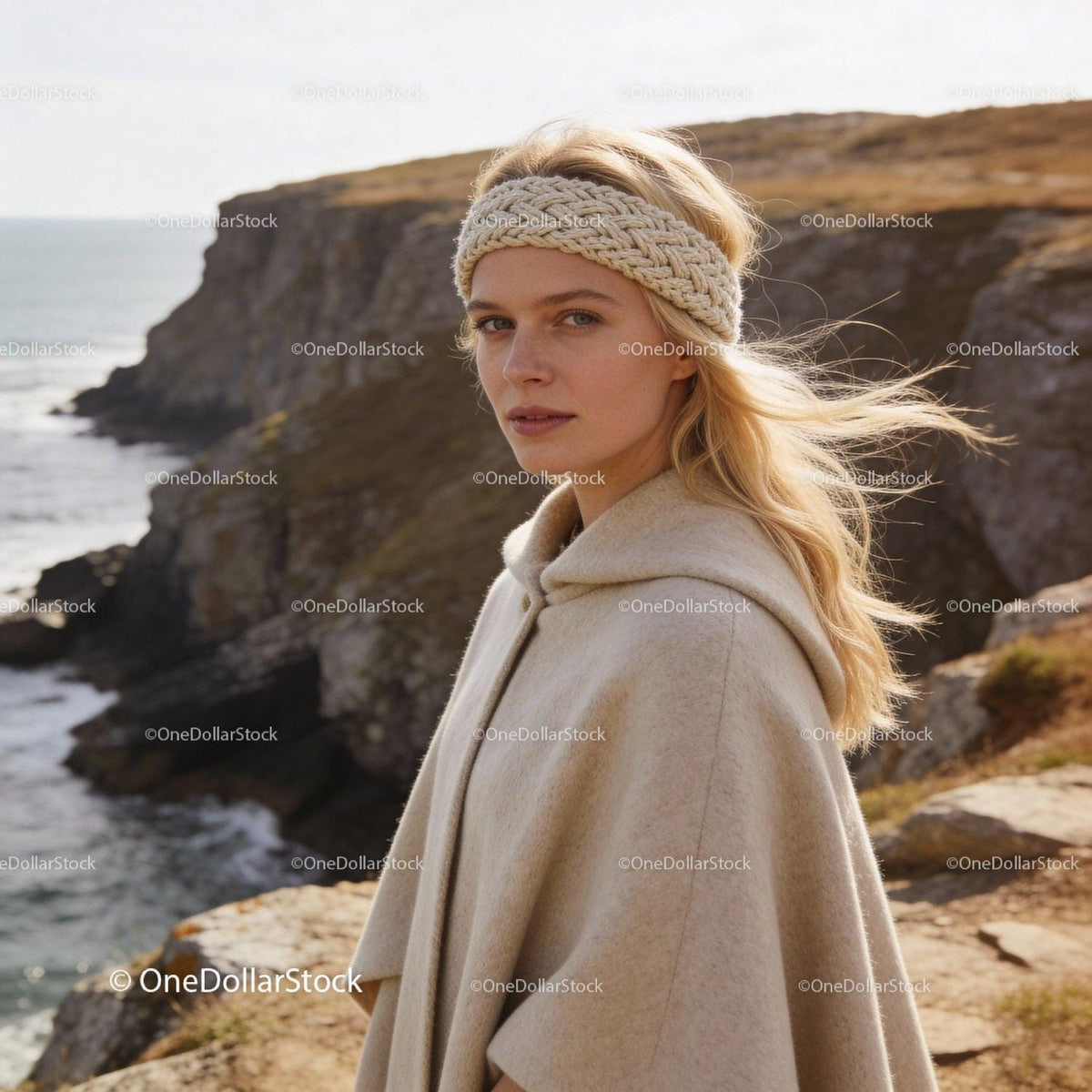 Blonde woman wearing knitted headband and beige coat outdoors