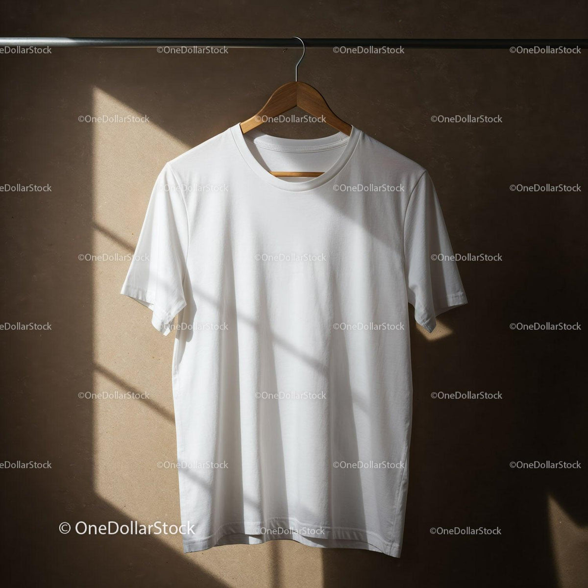 Minimalist white t-shirt hanging on wooden hanger with sunlight JPG Mockup Image preview