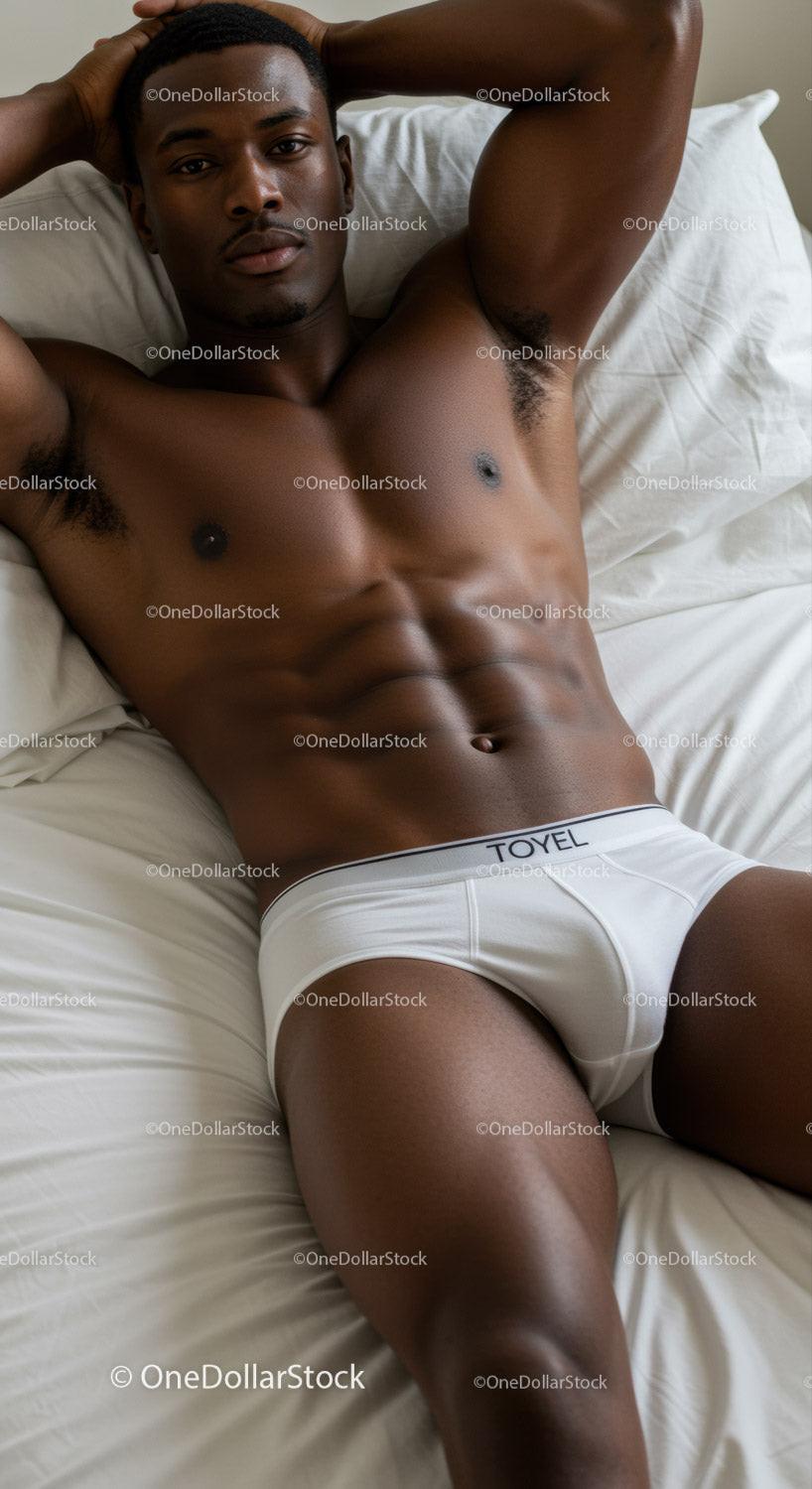 Relaxed Young Man Reclining on Bed in White Underwear