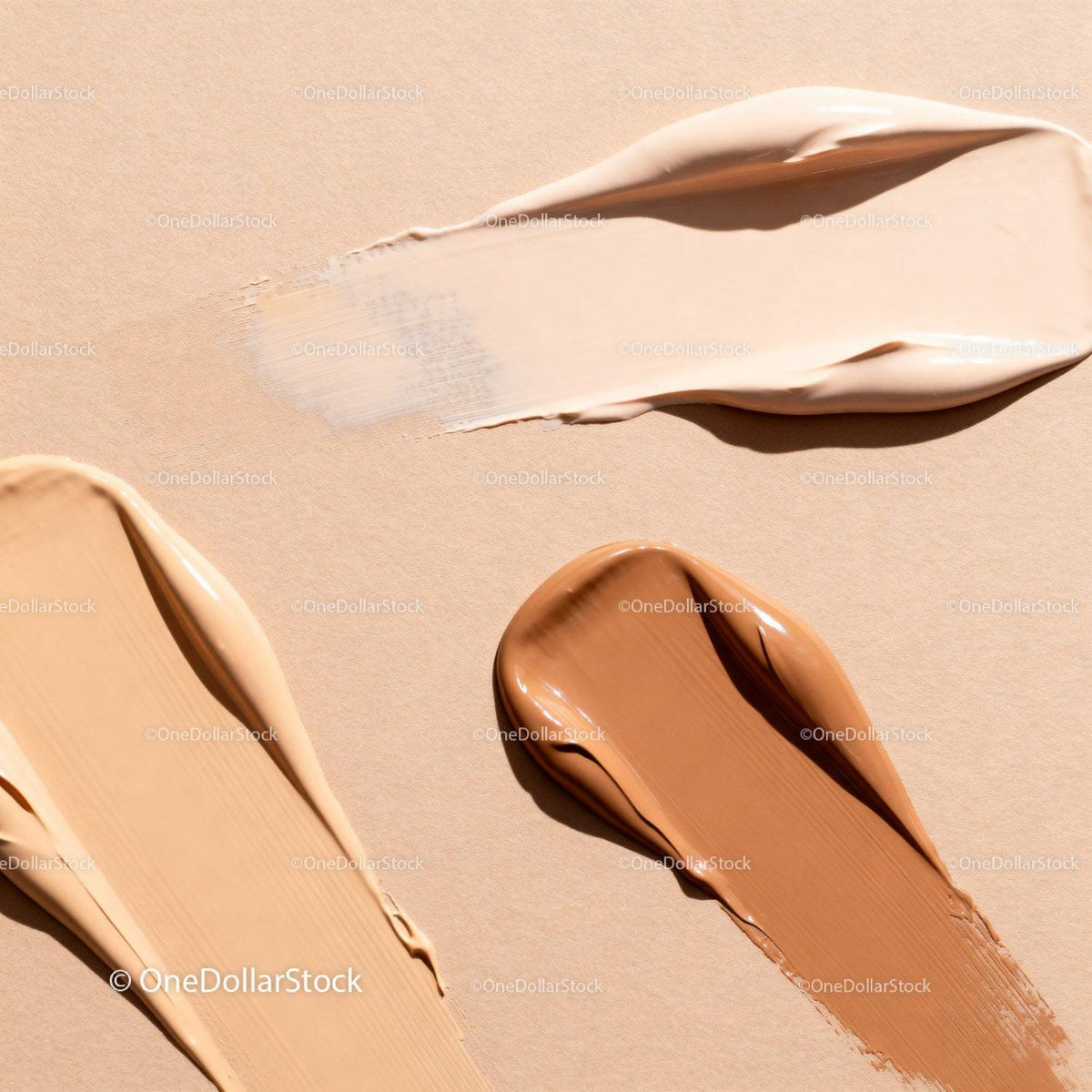 Diverse shades of creamy foundation texture swatches