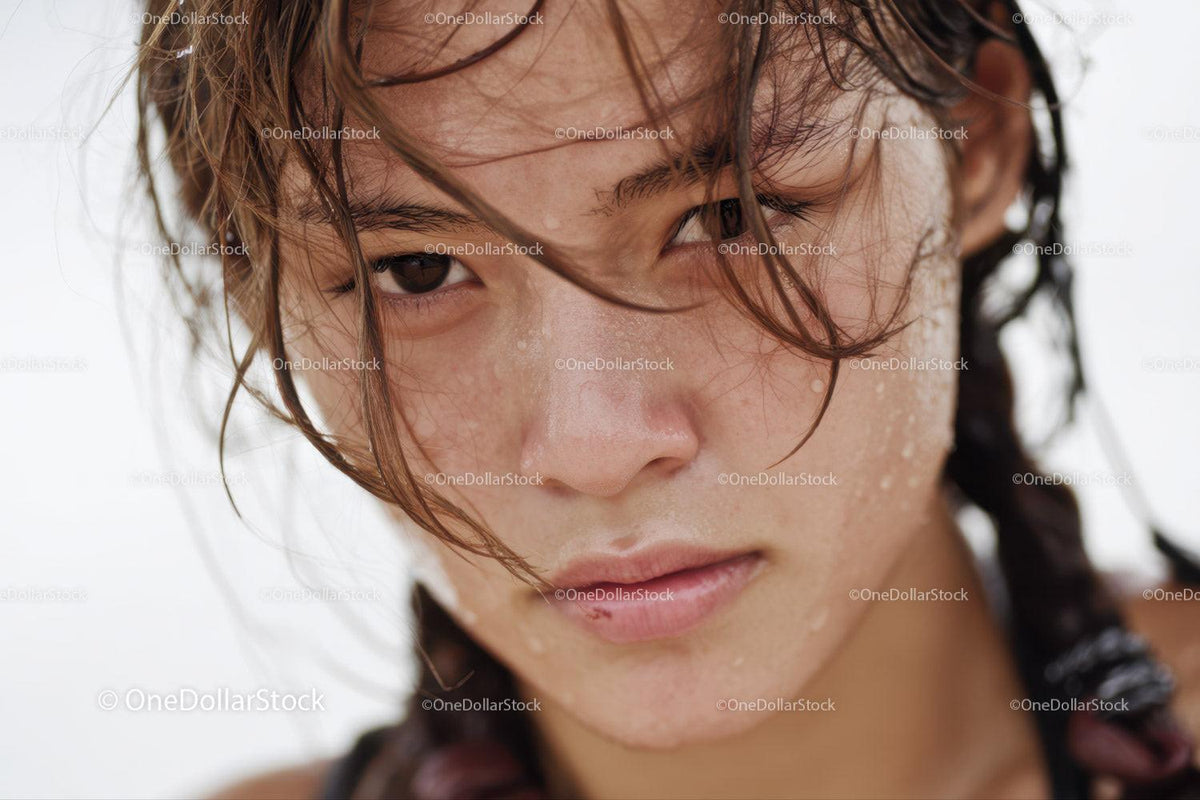 Close-up of a Young Woman with Wet Hair and Expressive Gaze