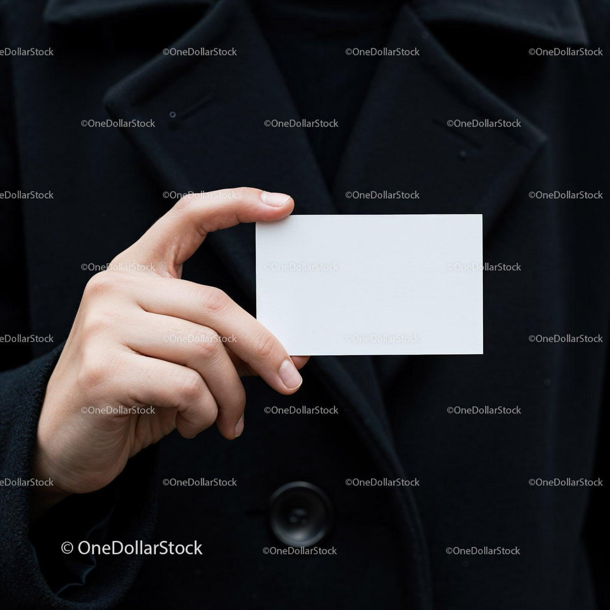 Person Holding Blank Business Card Against Black Coat JPG Mockup Image preview