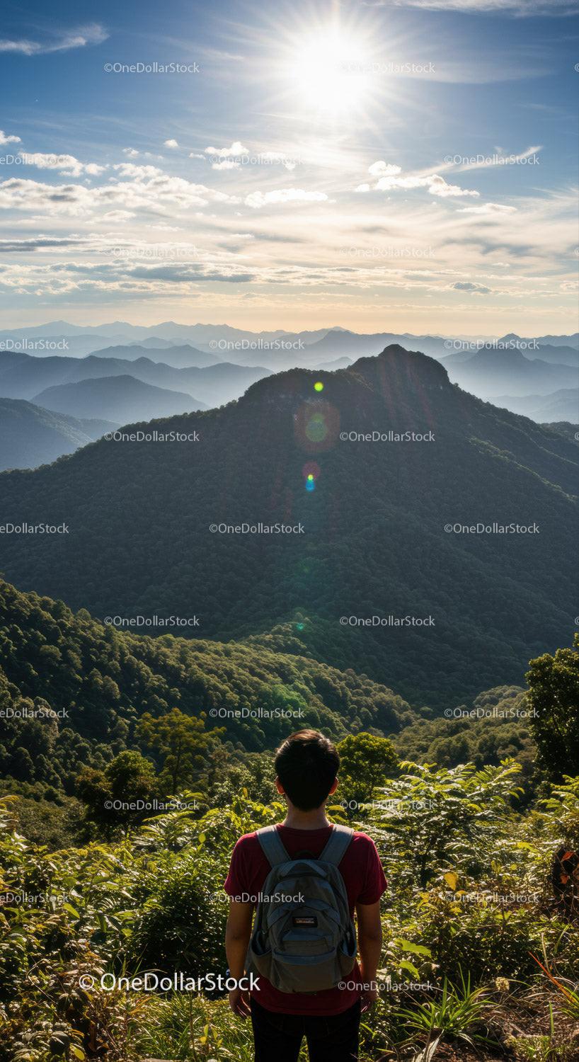 Breathtaking Mountain Landscape with Sunlit Peaks and Lush Forest