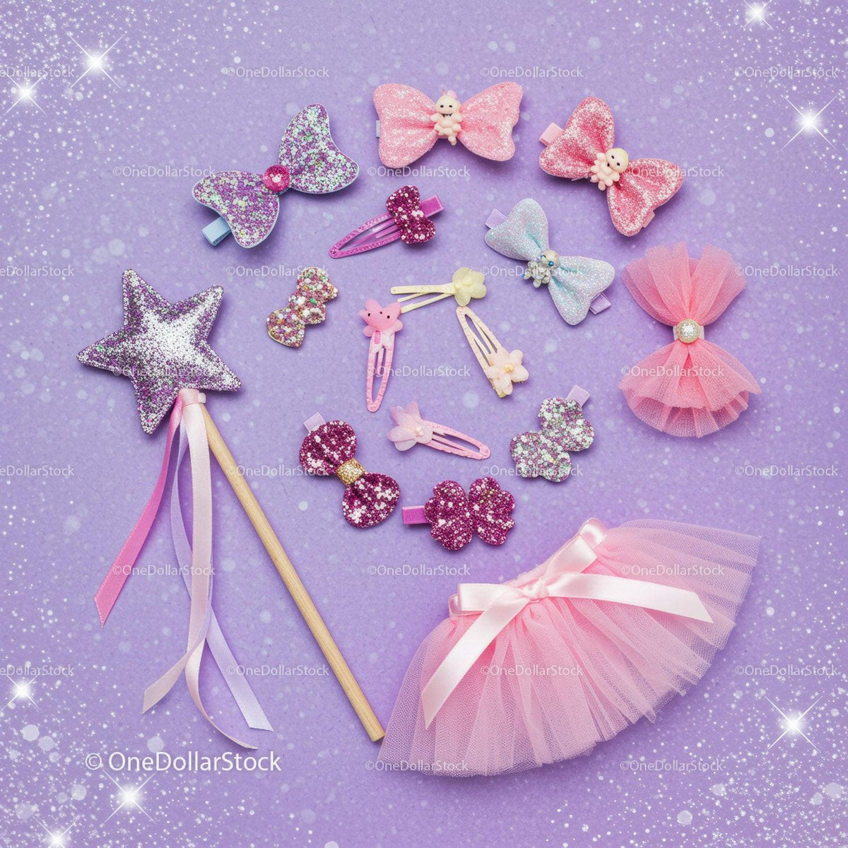 Glitter pink hair accessories and tutu on purple background