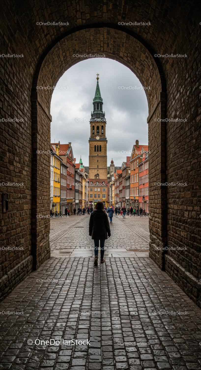 Historic European Town with Church Tower and Cobblestone Street