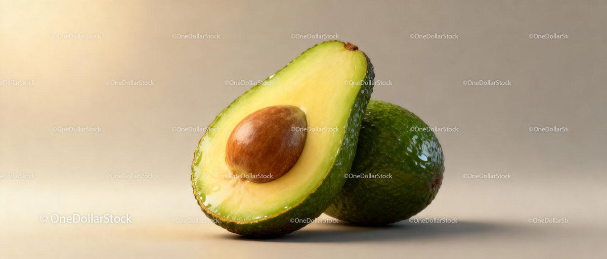 Fresh ripe avocado with a seed on neutral background