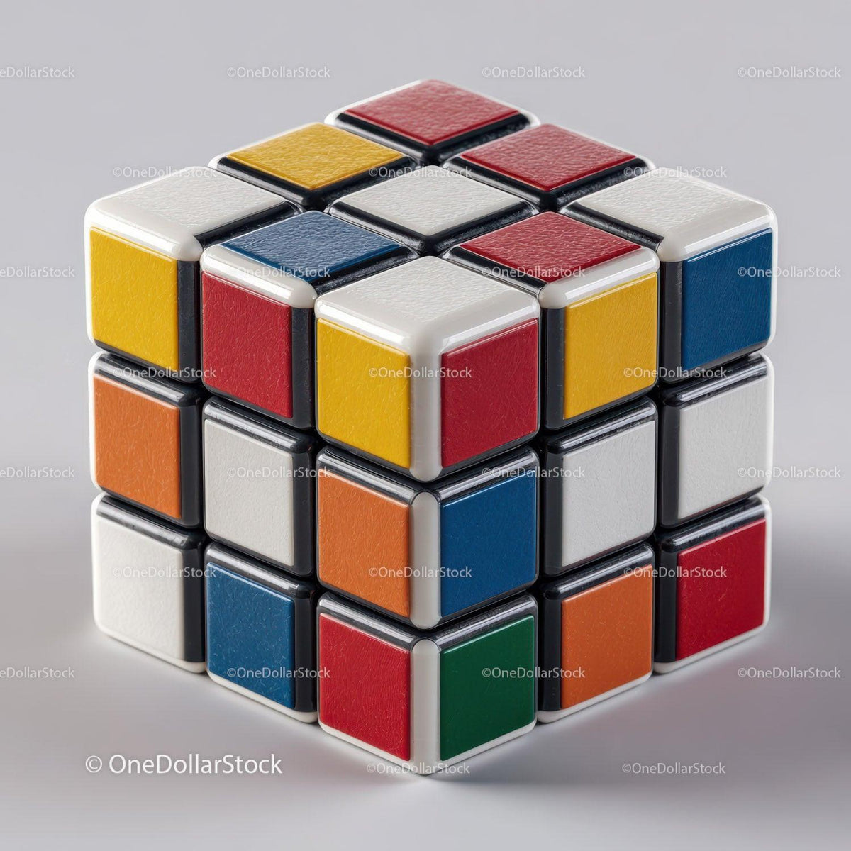 Colorful three-dimensional puzzle cube with small colored squares in a scrambled pattern on gray background
