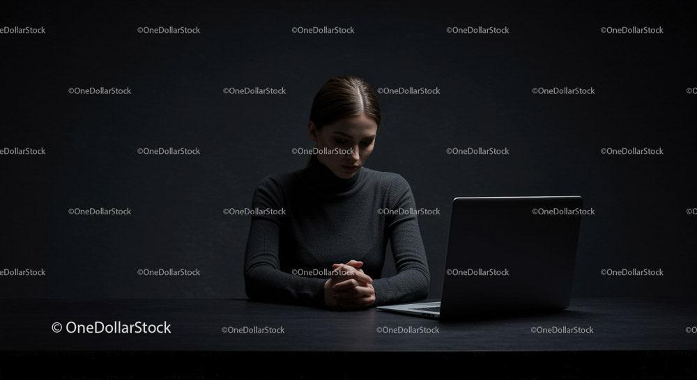 Thoughtful Woman at Laptop in Dark Modern Workspace Stock Photo Bundle preview 8