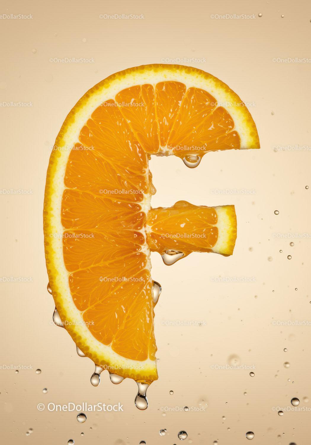Fresh Orange Slice Shaped Like Euro Symbol With Drops