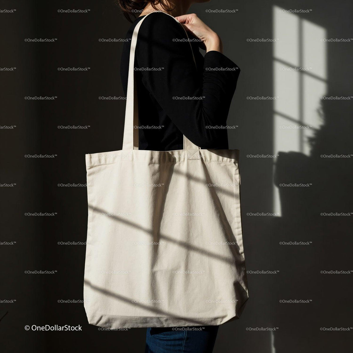 Minimalist canvas tote bag carried by woman in shadow JPG Mockup Image preview